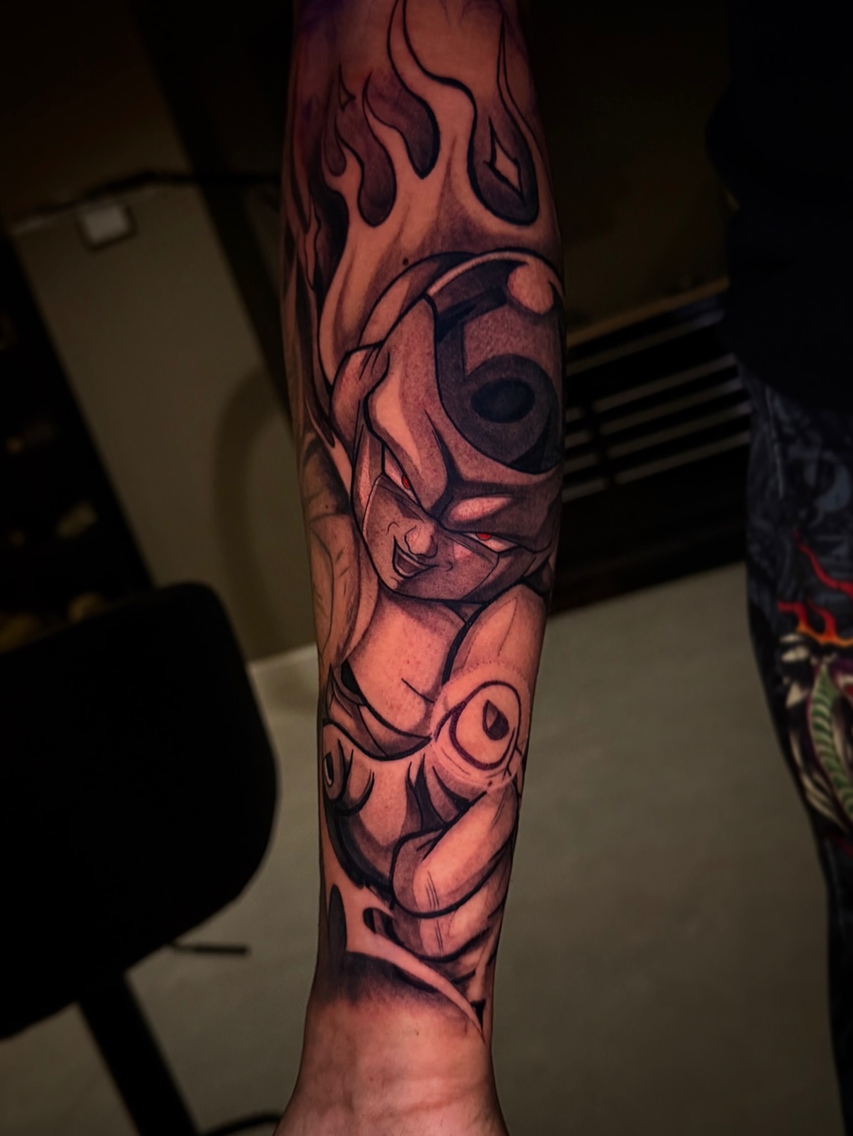 Son goku black and grey tattoo on the forearm by Aiden Madrigal