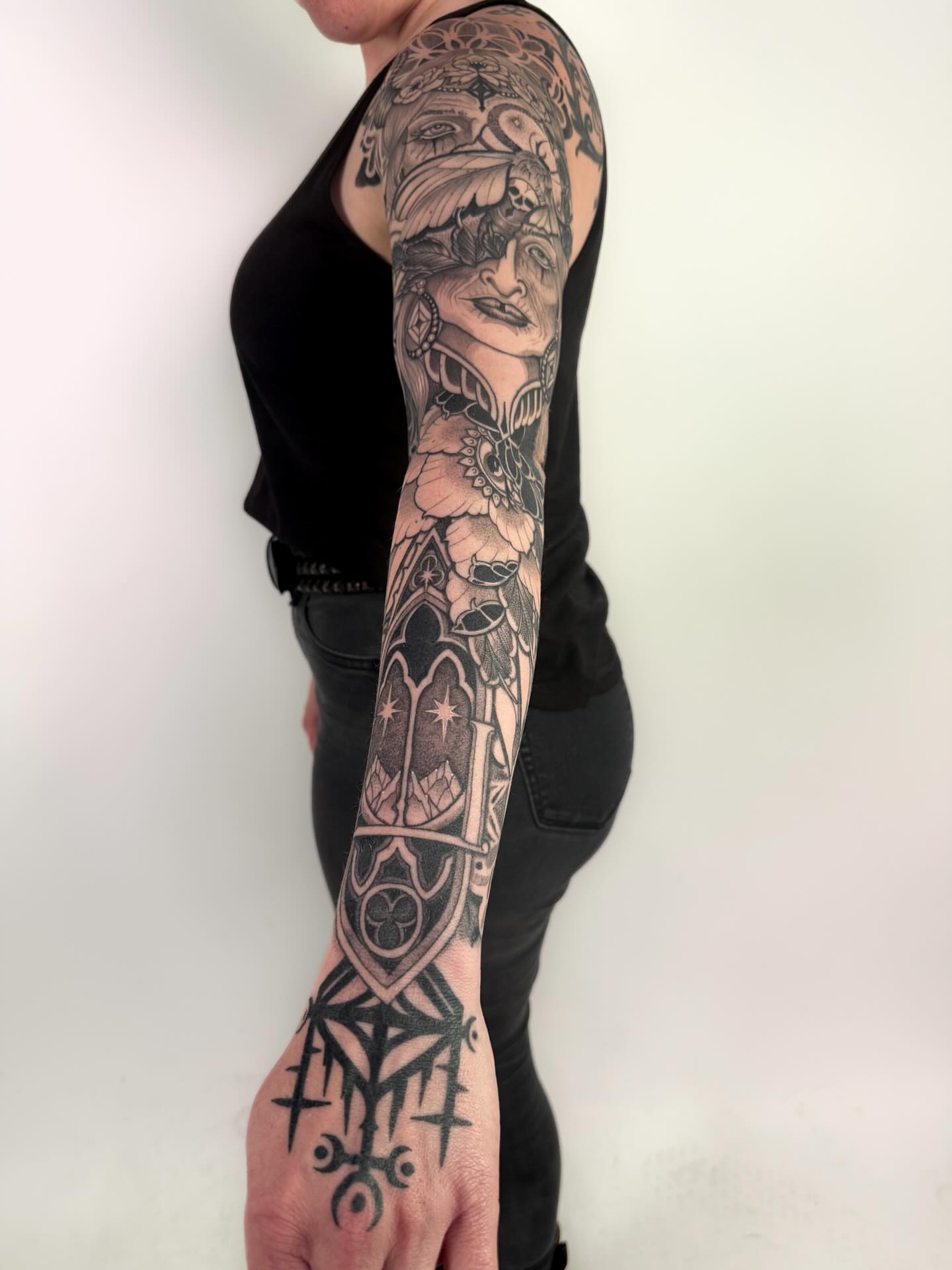 Woman with bird American traditional tattoo on the forearm by Jamie Beach, Wheat Ridge, Colorado