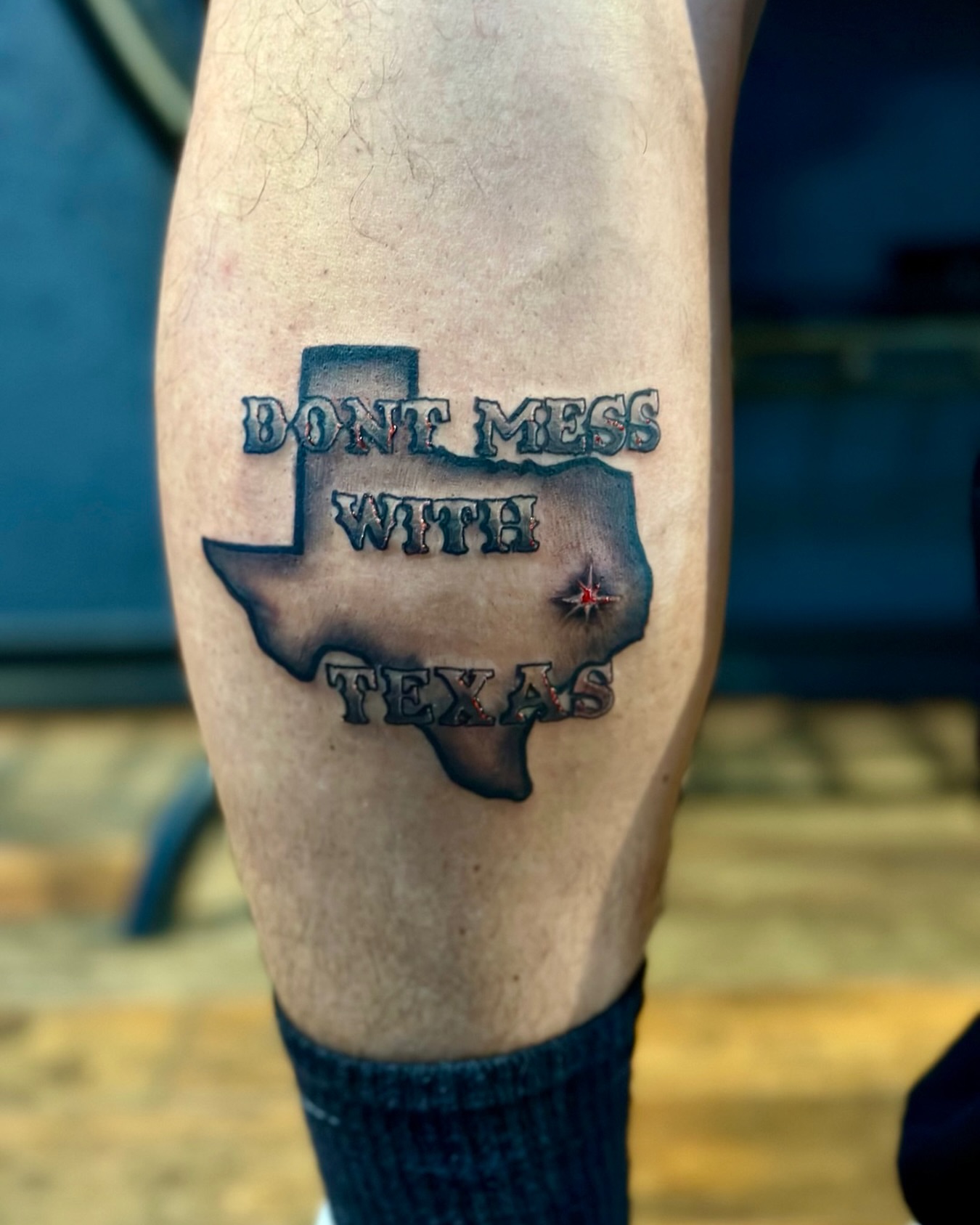 Don't mess with texas black and grey tattoo on the forearm by Deacon Moser