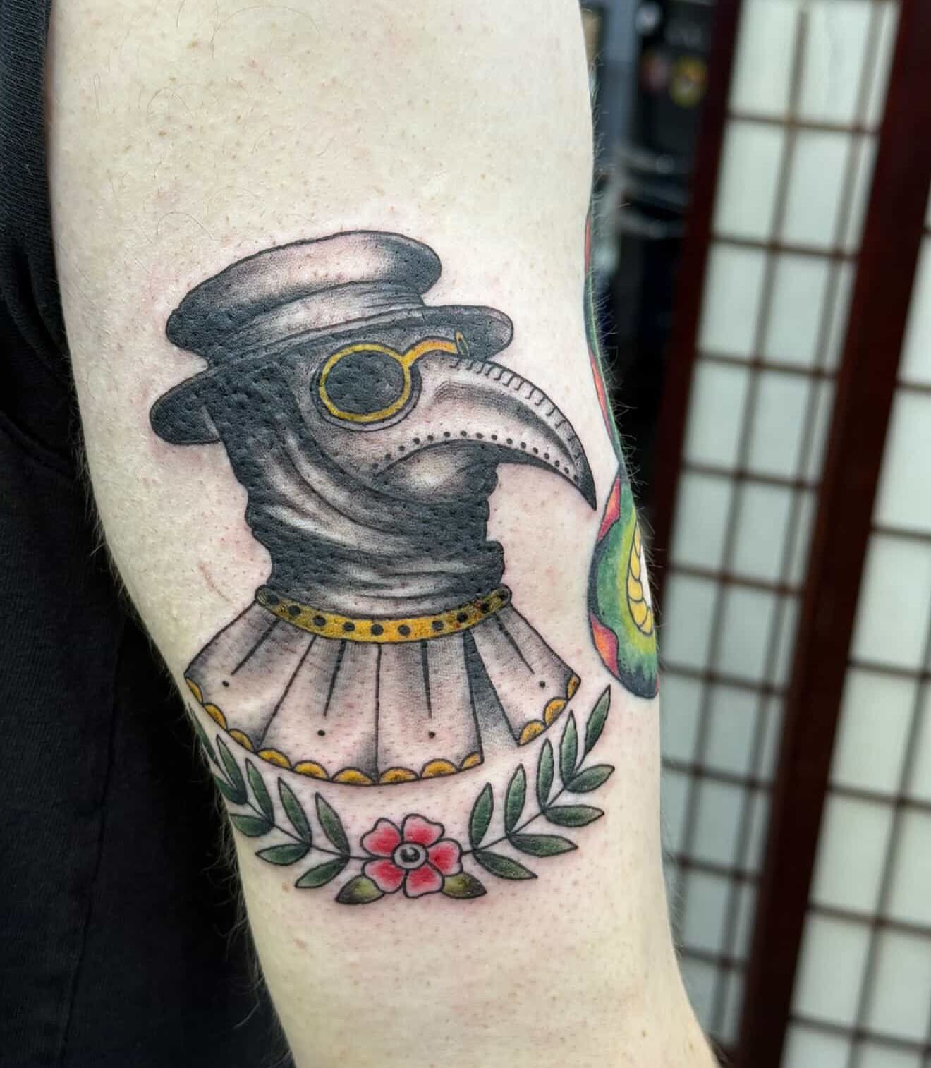 Plague doctor mask American traditional tattoo on the forearm by Olivia Norbert
