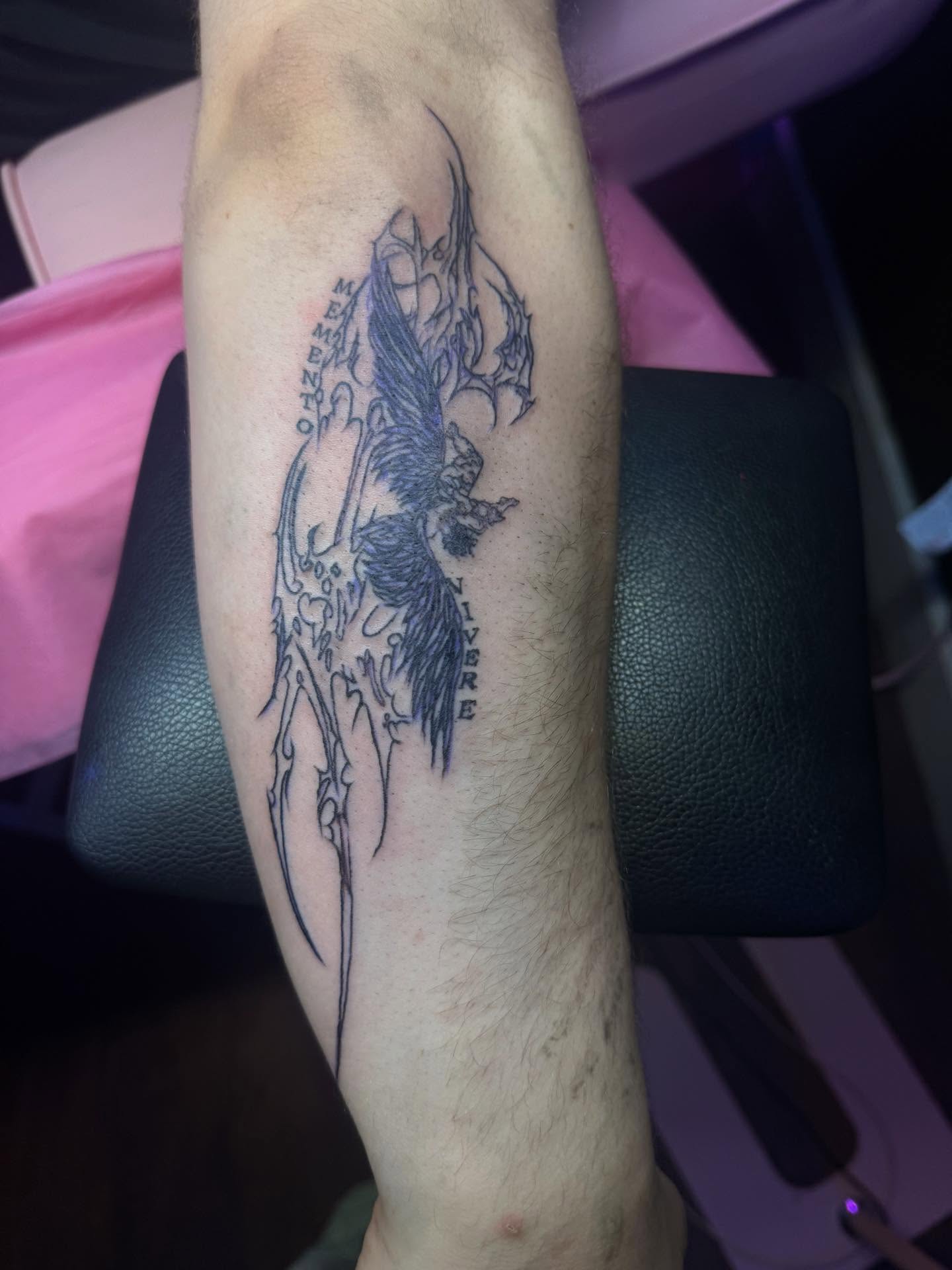 Phoenix black and grey tattoo on the forearm by Tattoos by Santos