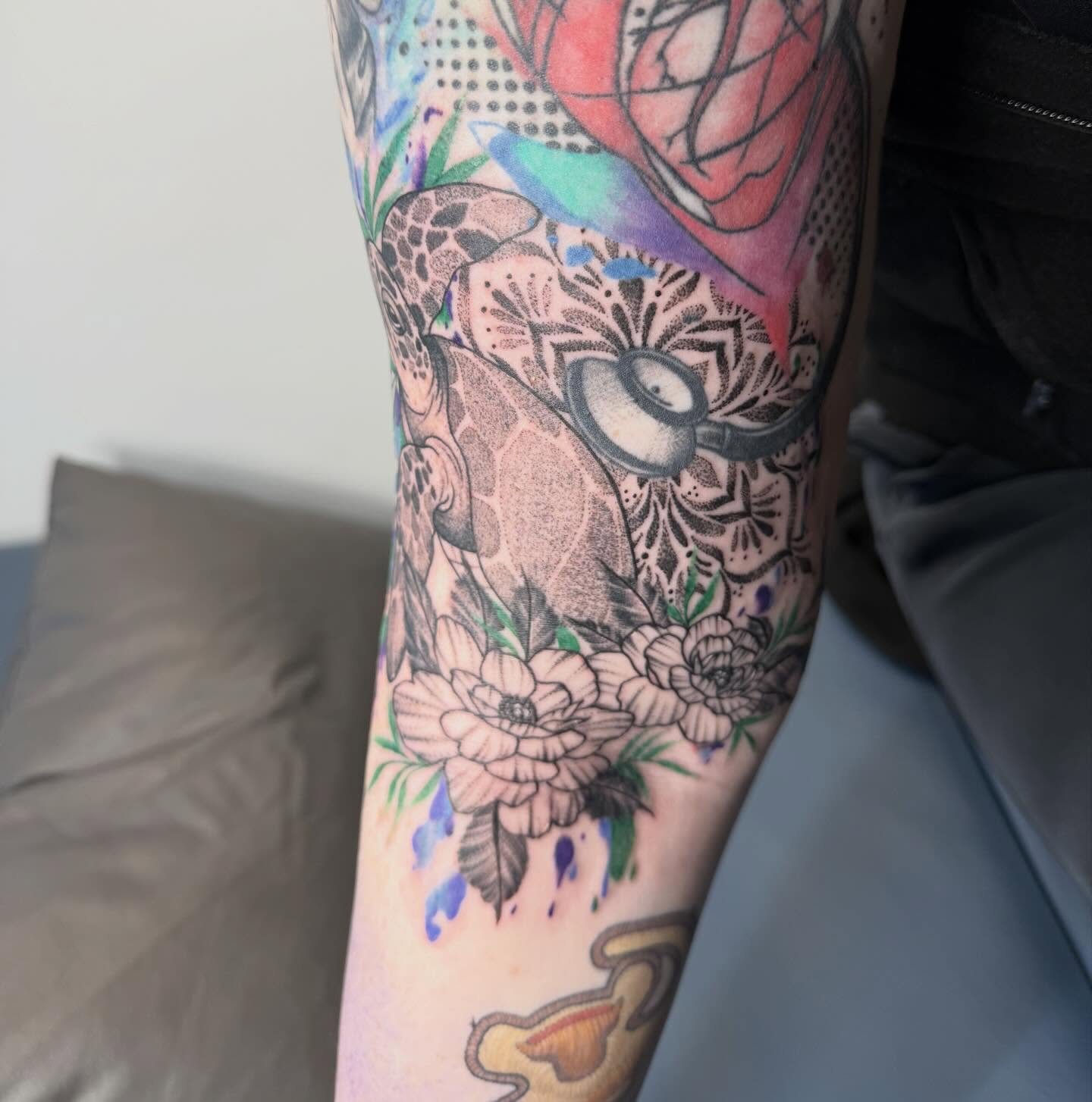 Floral bouquet dotwork tattoo on the forearm by Abby