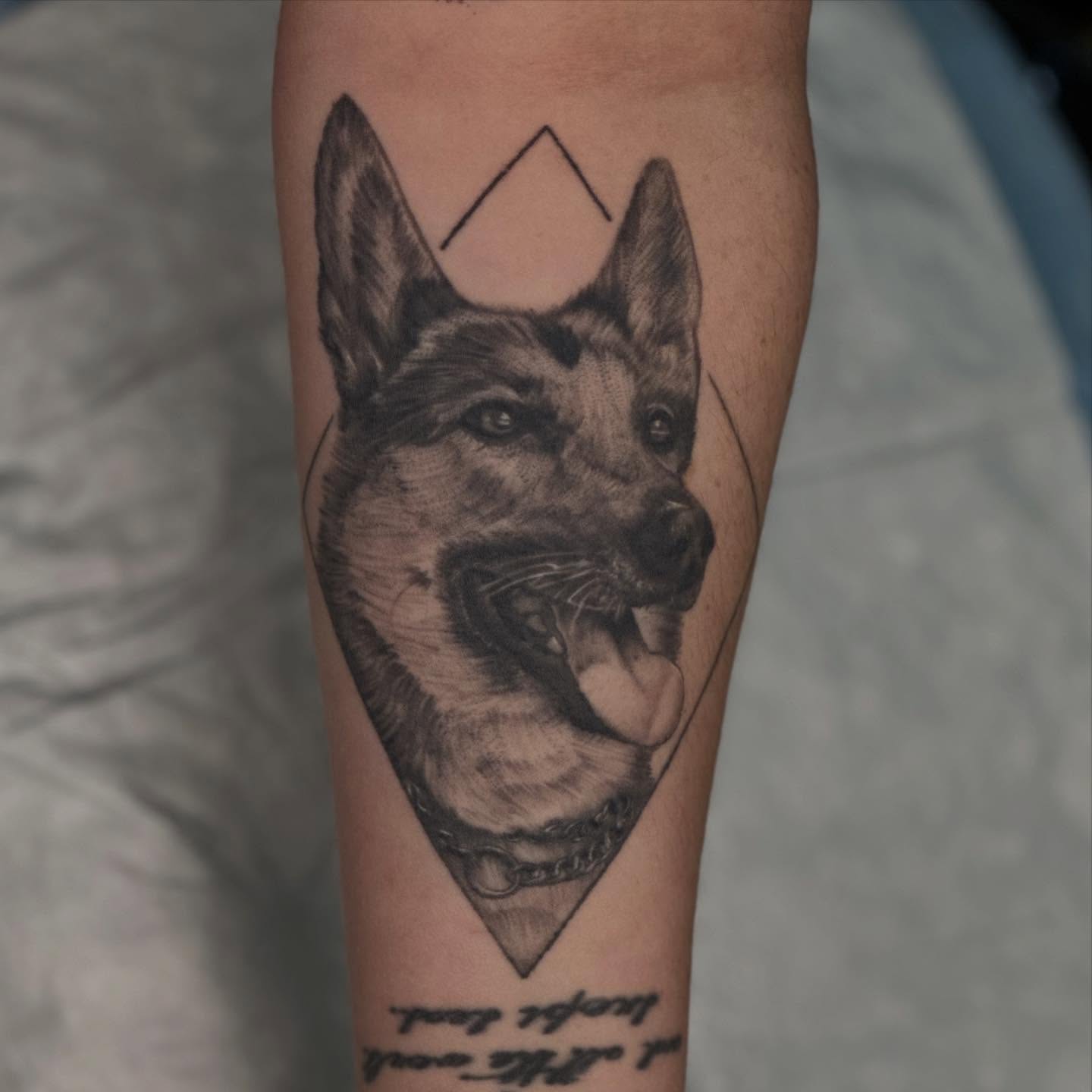 Dog realism tattoo on the forearm by Dylan Curry
