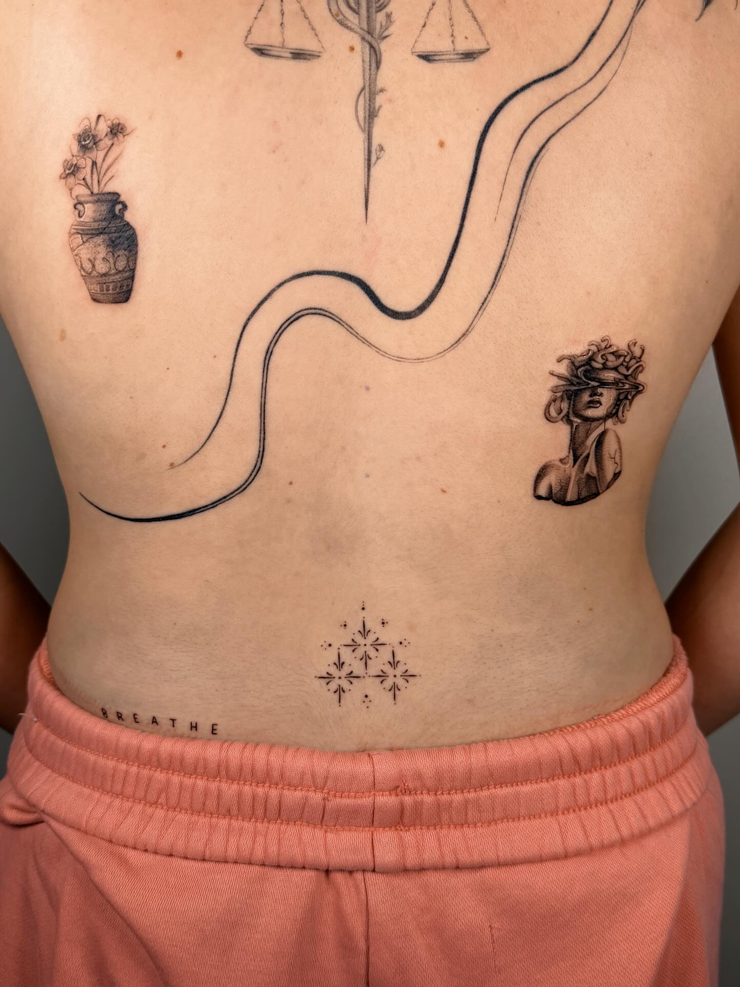 Snake and woman black and grey tattoo on the torso by Nate Weaver