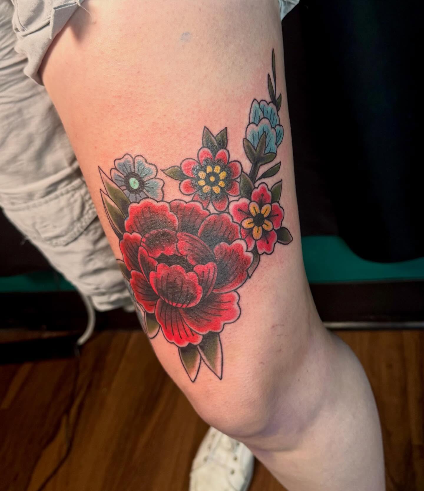 Floral bouquet American traditional tattoo on the forearm by Kalina Lynn