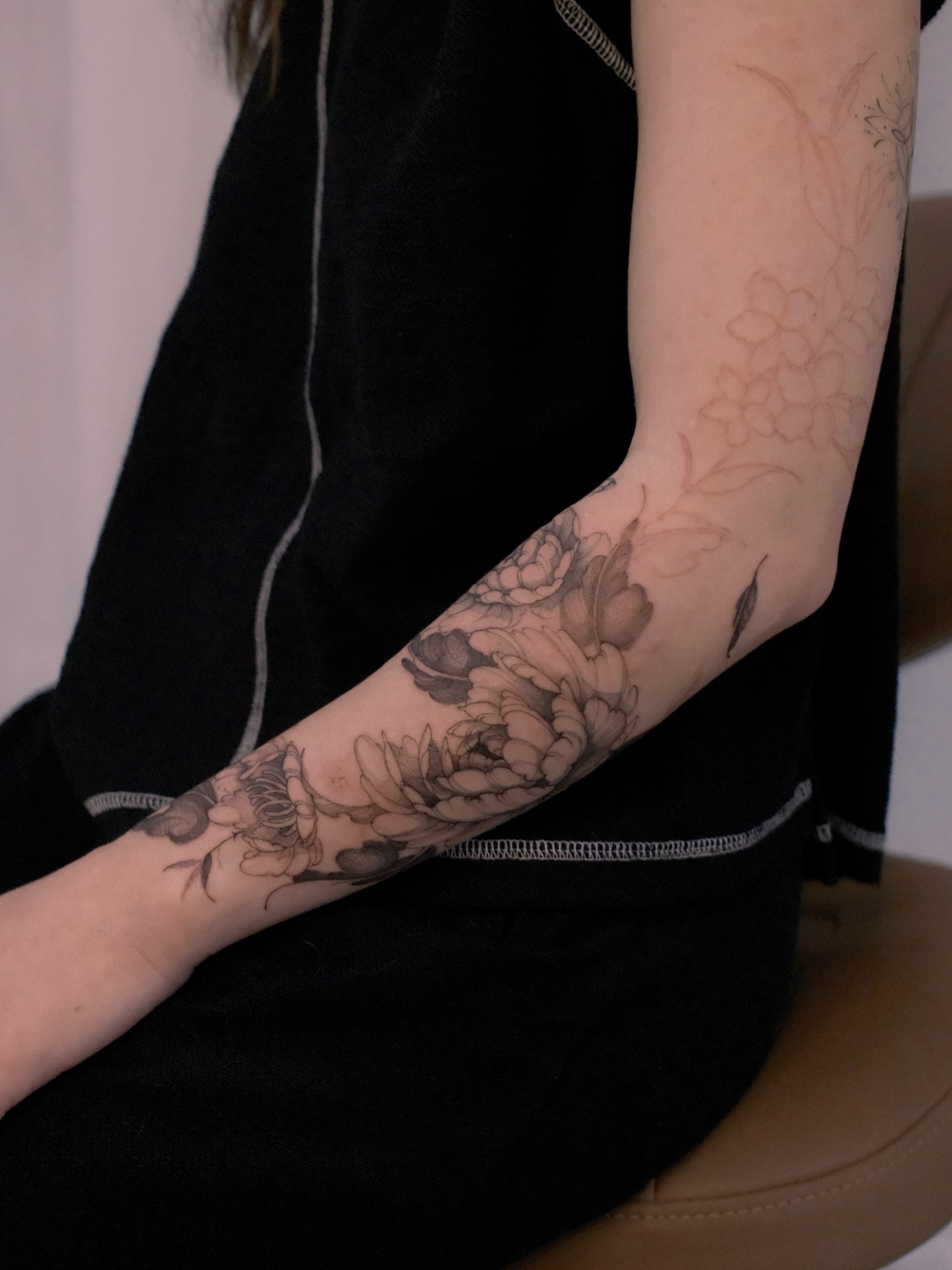Floral bouquet black and grey tattoo on the forearm by Joy, Gold Coast, Queensland