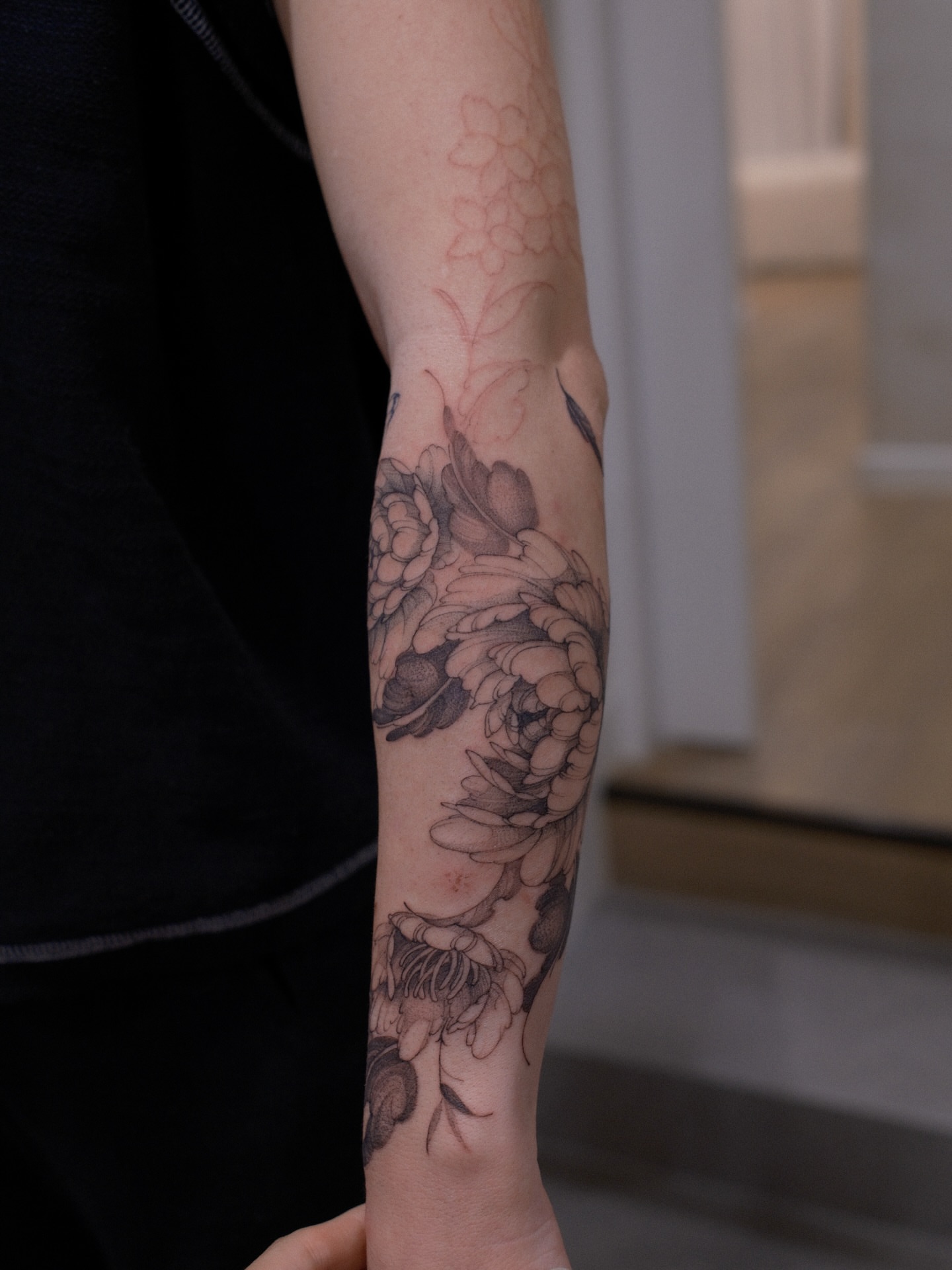 Floral bouquet black and grey tattoo on the forearm by Joy, Gold Coast, Queensland