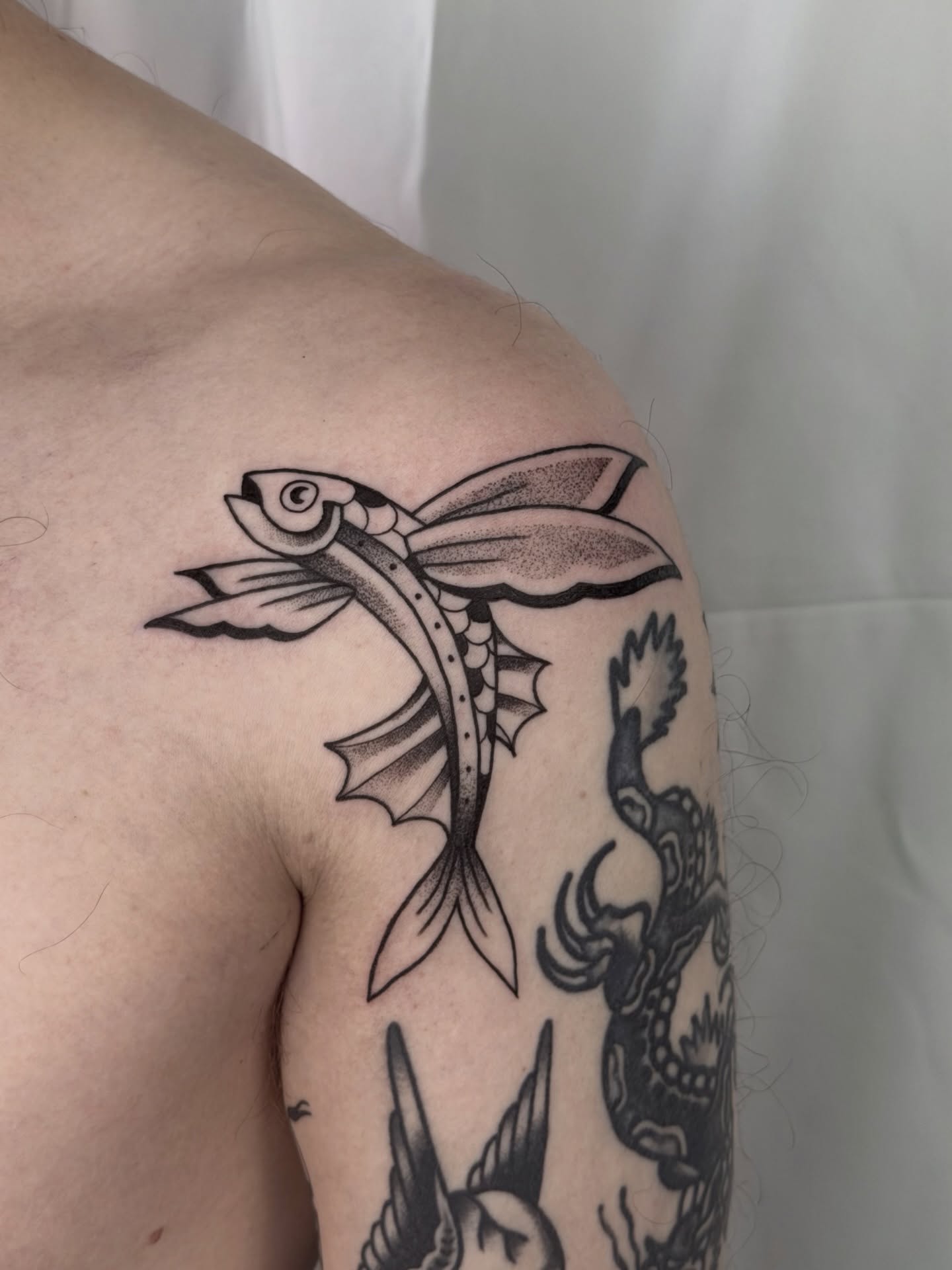 Flying fish American traditional tattoo on the shoulder by Kailey Ru, Knoxville, Tennessee