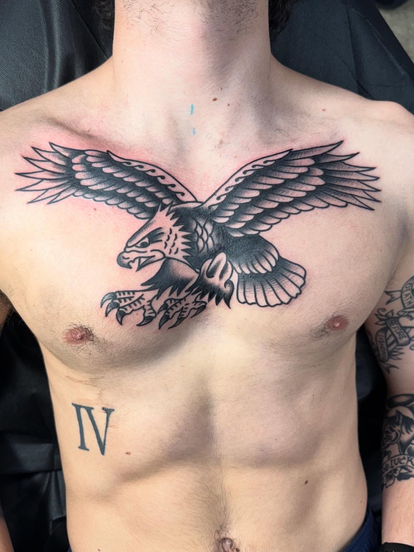 Eagle black and grey tattoo on the chest by Jesse Coldiron