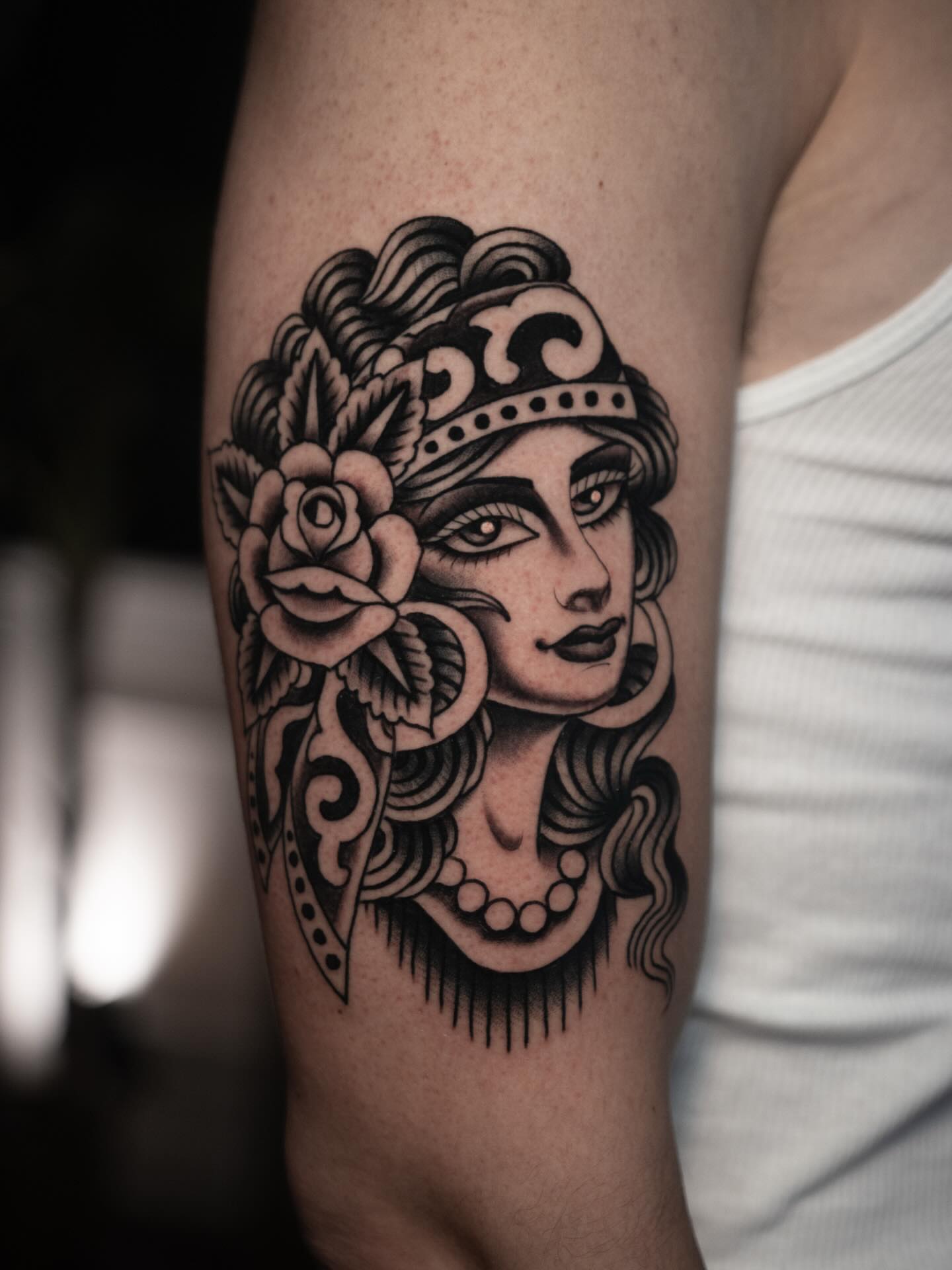 Woman with floral crown American traditional tattoo on the forearm by Danny Derrick, San Luis Obispo, California