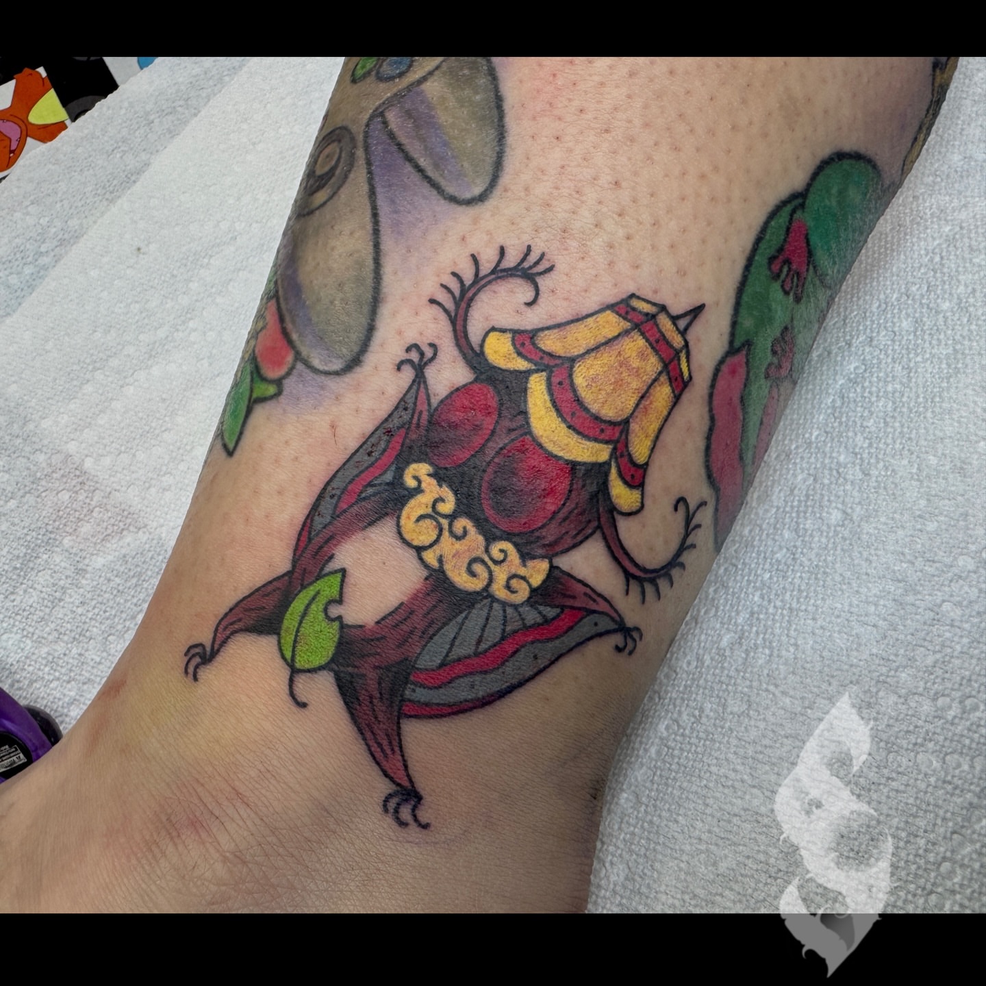 Koi fish American traditional tattoo on the forearm by Amanda Stampfly
