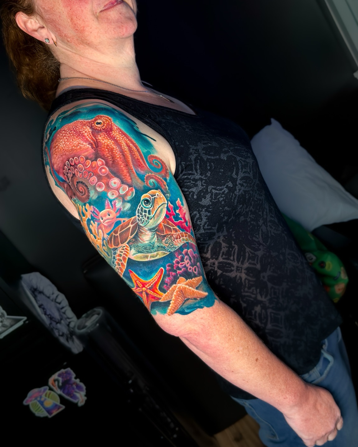 Underwater scene realism tattoo on the upper arm by Amy Zager