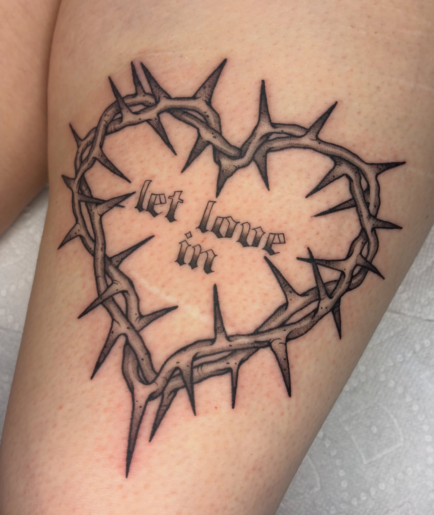 Let love in black and grey tattoo on the thigh by Lance 🦈