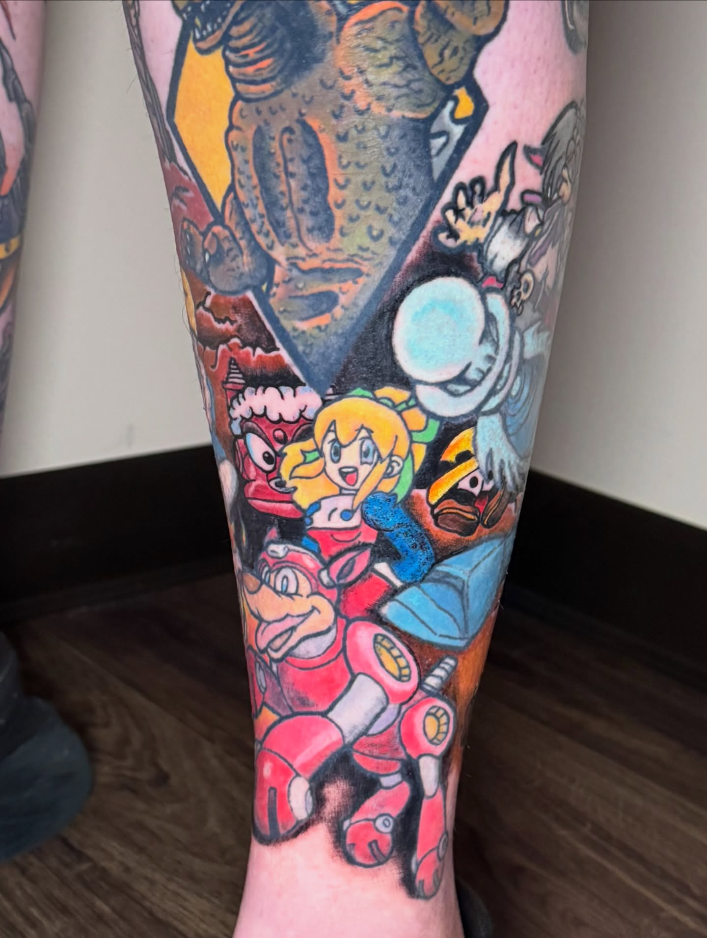 Video game characters new school tattoo on the leg by Bob Howdy