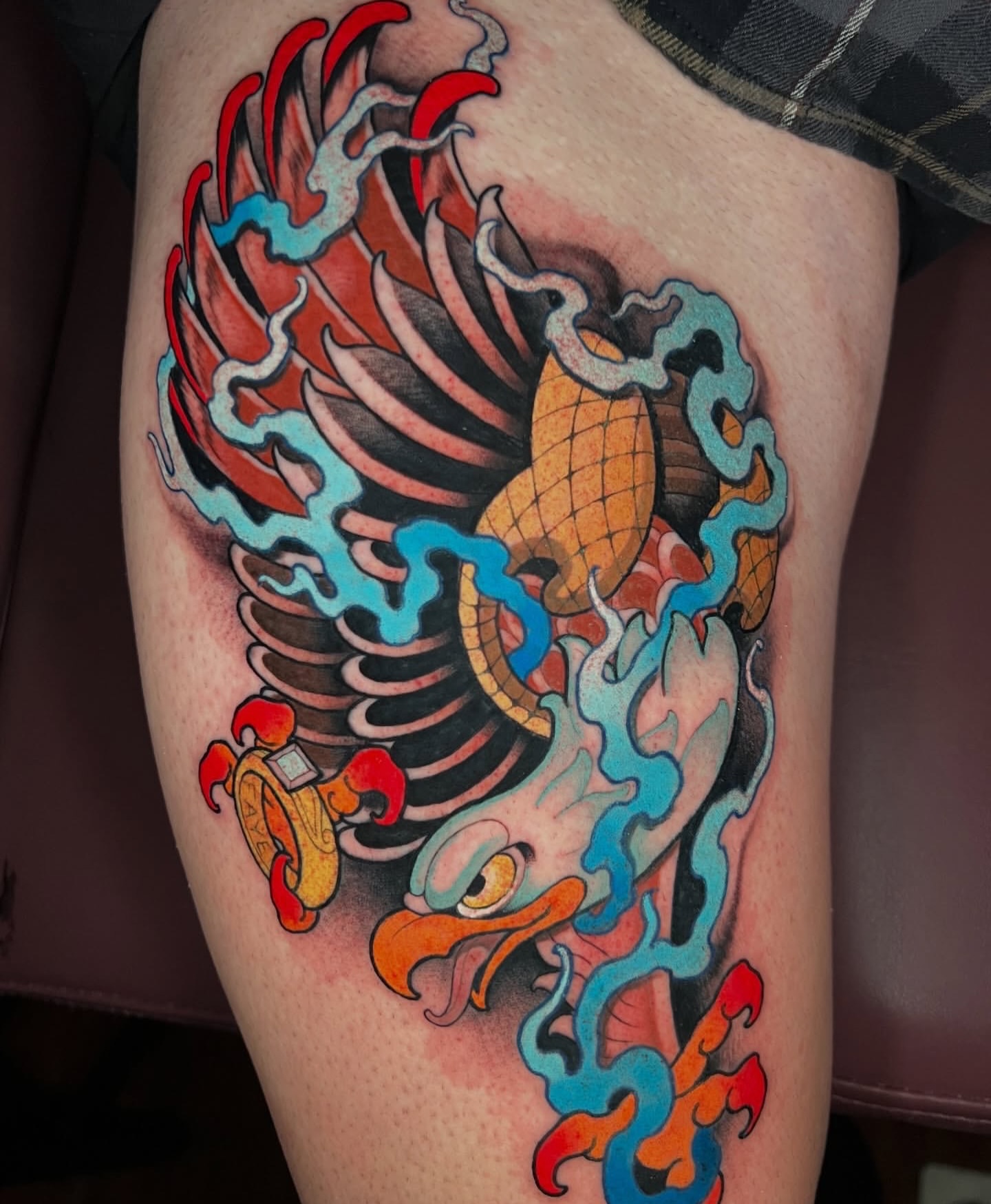 Phoenix American traditional tattoo on the thigh by Skyler Miller