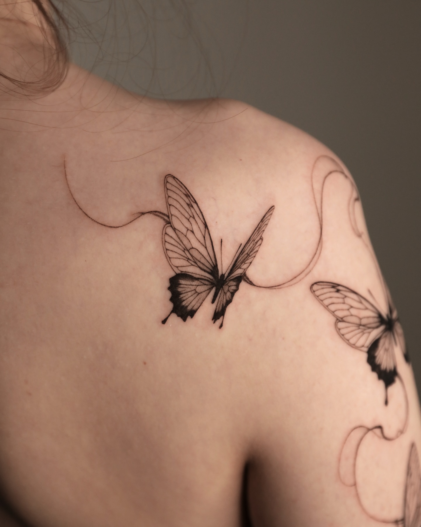 Butterfly black and grey tattoo on the shoulder by @tattoo_chamsae