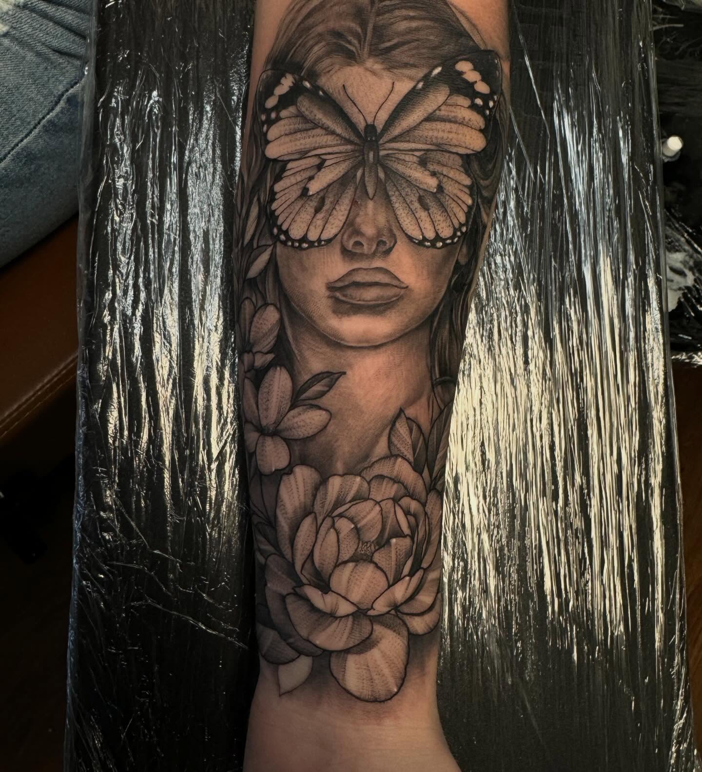 Woman with butterfly realism tattoo on the forearm by Kyle Ketzler