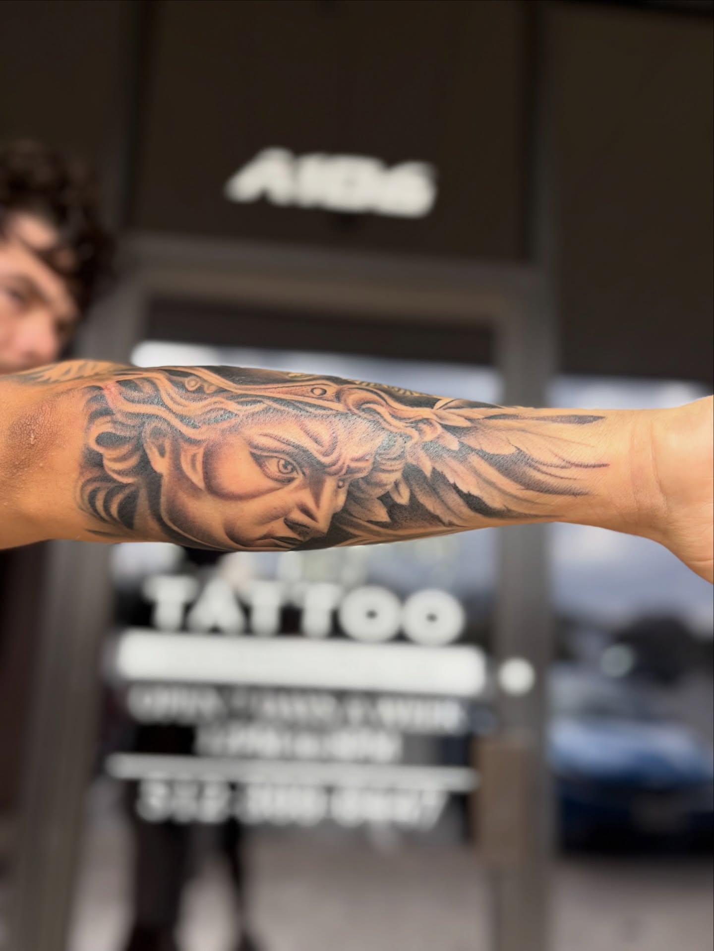 Medusa head realism tattoo on the forearm by Eric Garcia