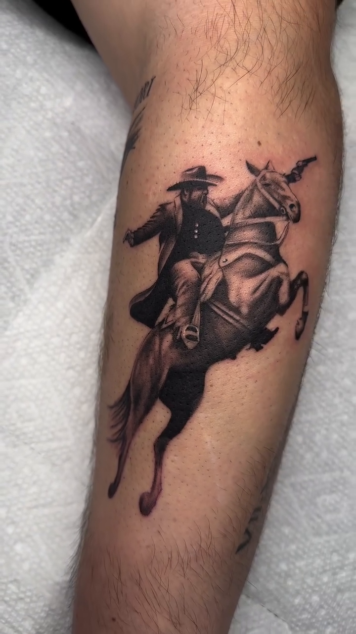 Cowboy riding a horse realism tattoo by Tat by Brendan