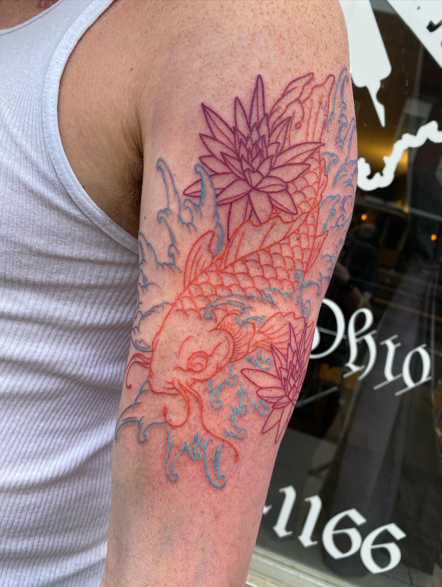 Koi fish and lotus flower japanese irezumi tattoo on the forearm by Savanna Starr Mortensen