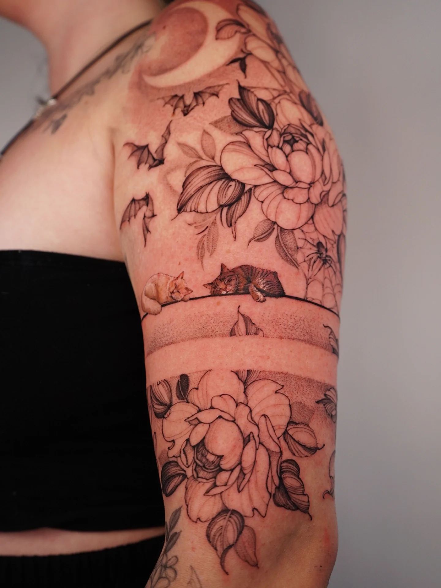 Cats and flowers dotwork tattoo on the forearm by Vii