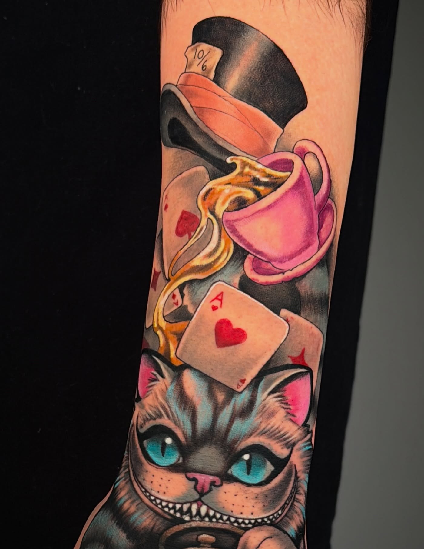Cheshire cat American traditional tattoo on the forearm by Wendy Ruiz