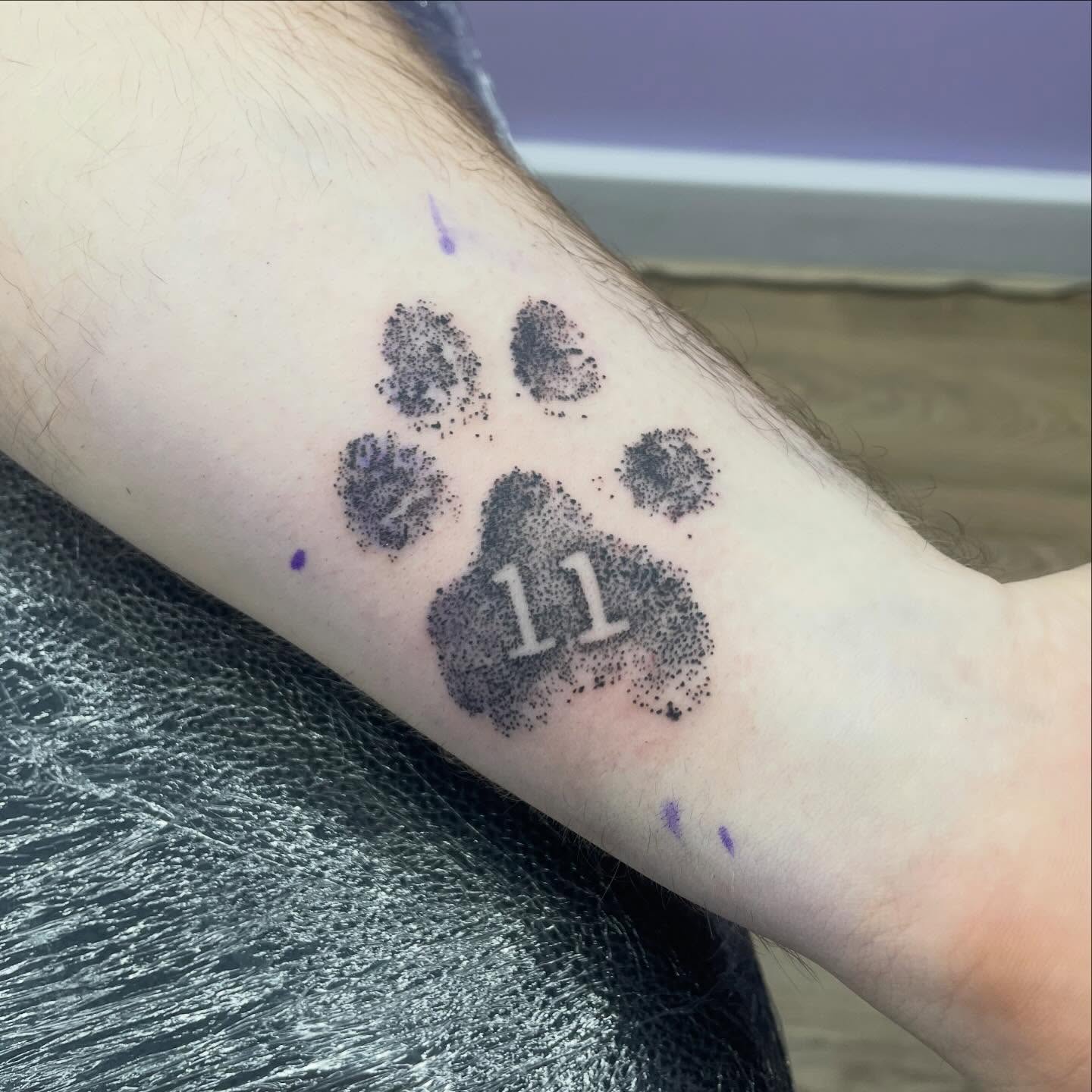 Paw prints dotwork tattoo on the forearm by elly, Oakham