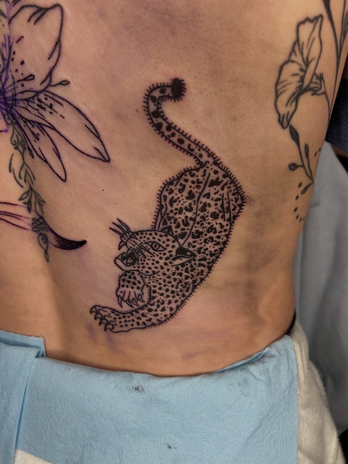 Leopard black and grey tattoo on the ribs by Cleveland Tattoo Artist, Cleveland, Ohio