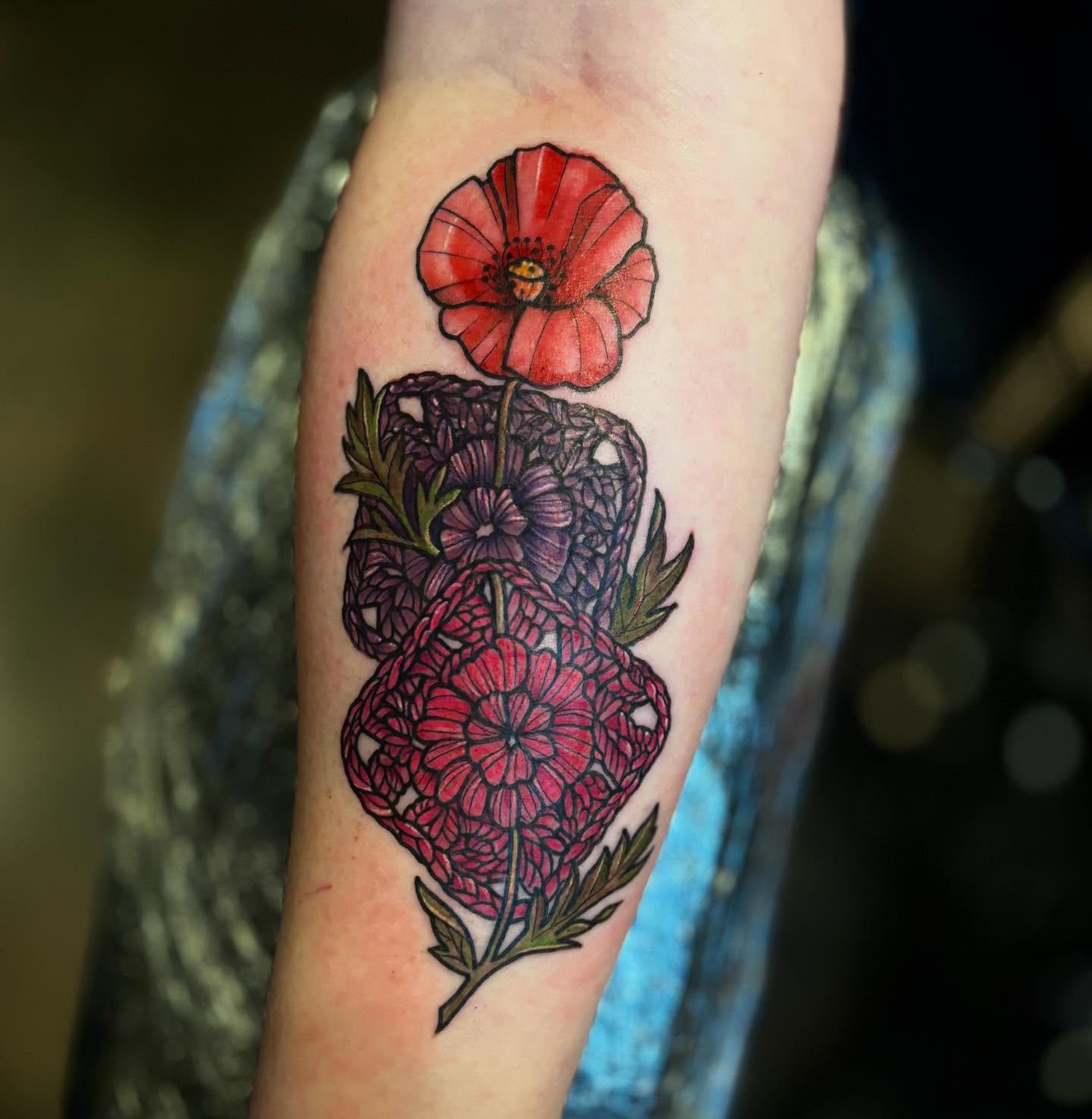 Floral arrangement realism tattoo on the forearm by Mim