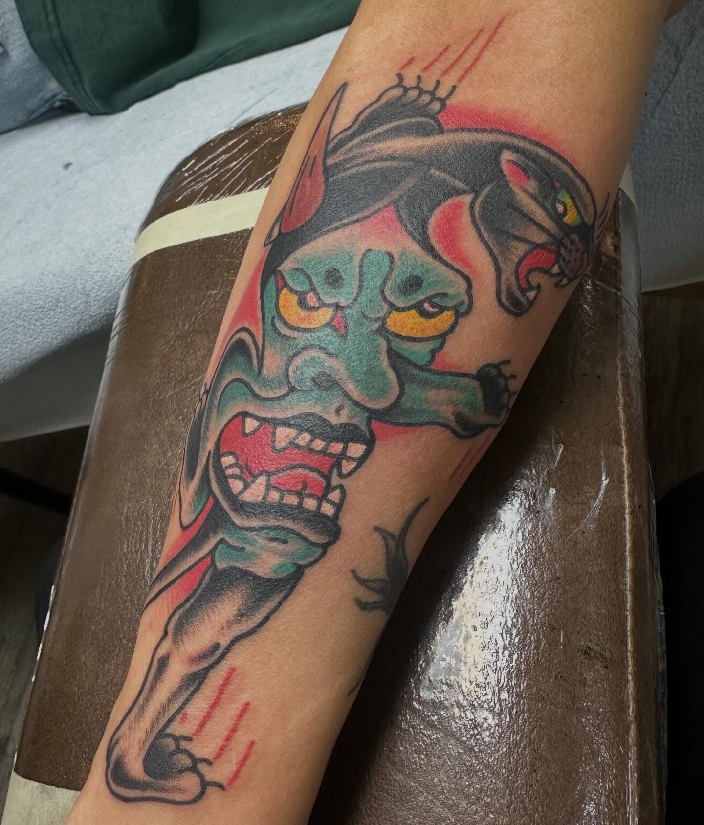 Panther American traditional tattoo on the forearm by Devin Spenny