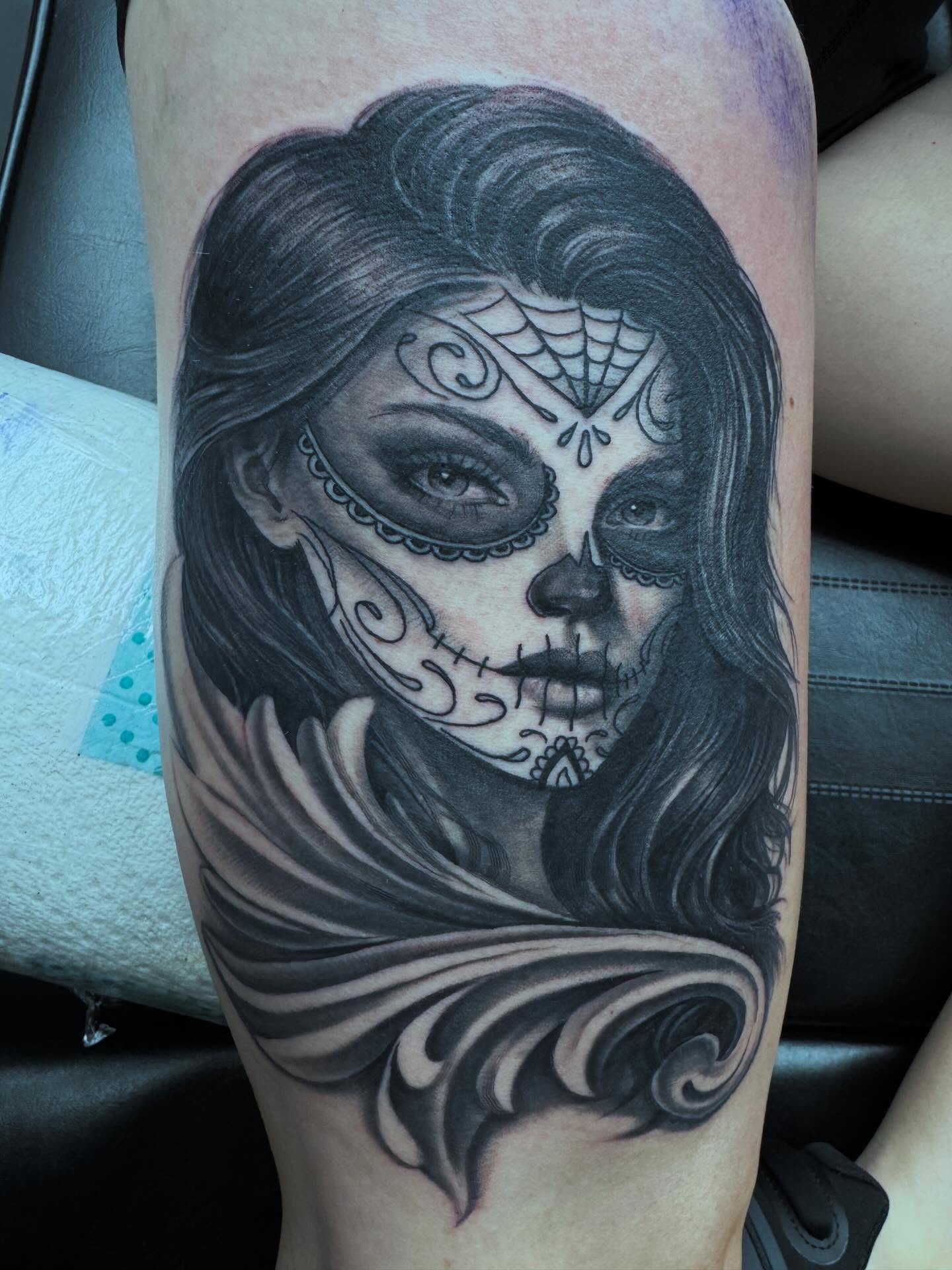 Sugar skull realism tattoo on the forearm by Bobby Hurst