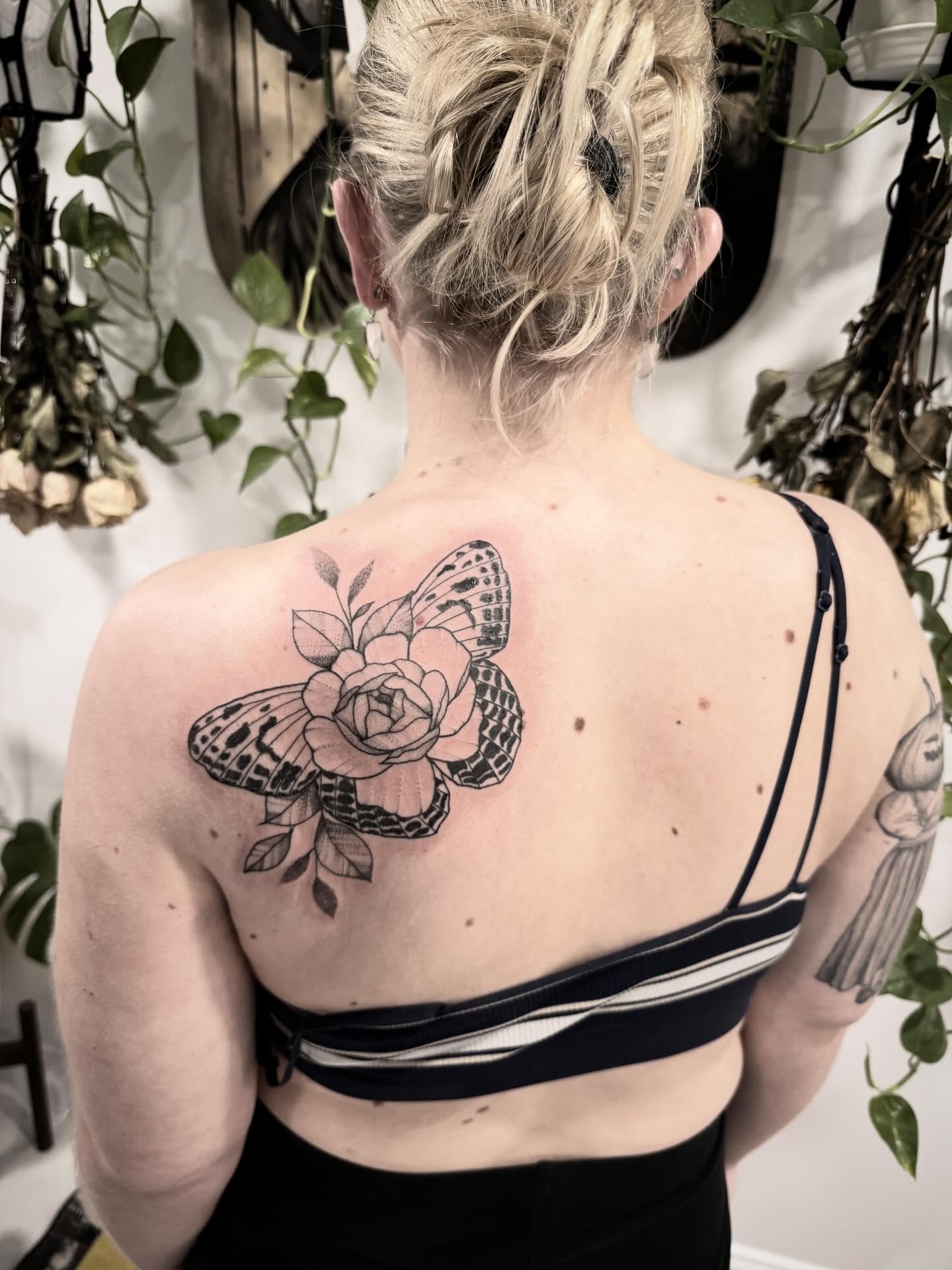 Rose and butterfly black and grey tattoo on the back by Shannon Misitano