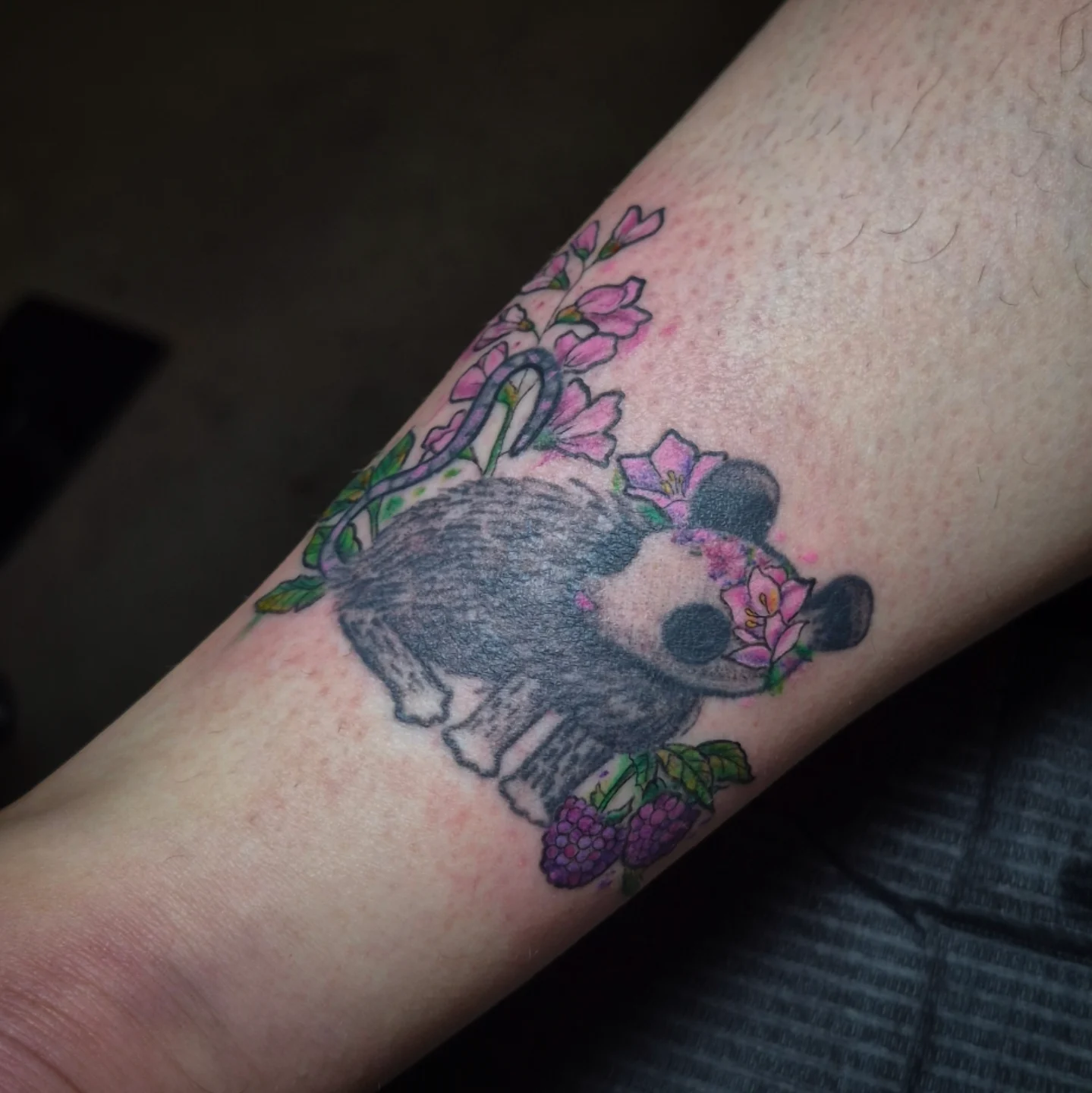 Panda and flowers new school tattoo on the forearm by Lydia Kiley