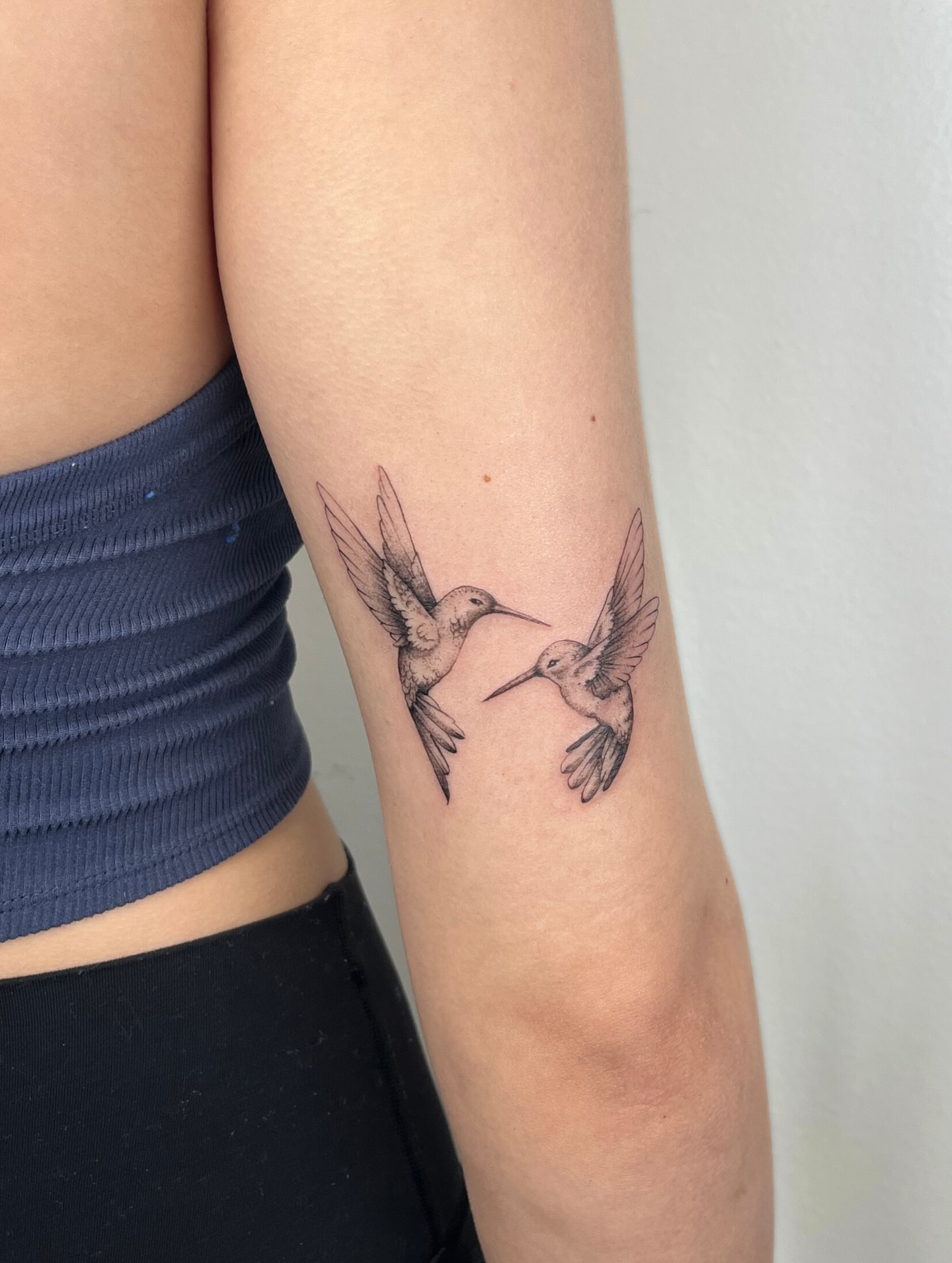 Hummingbirds black and grey tattoo on the forearm by kt