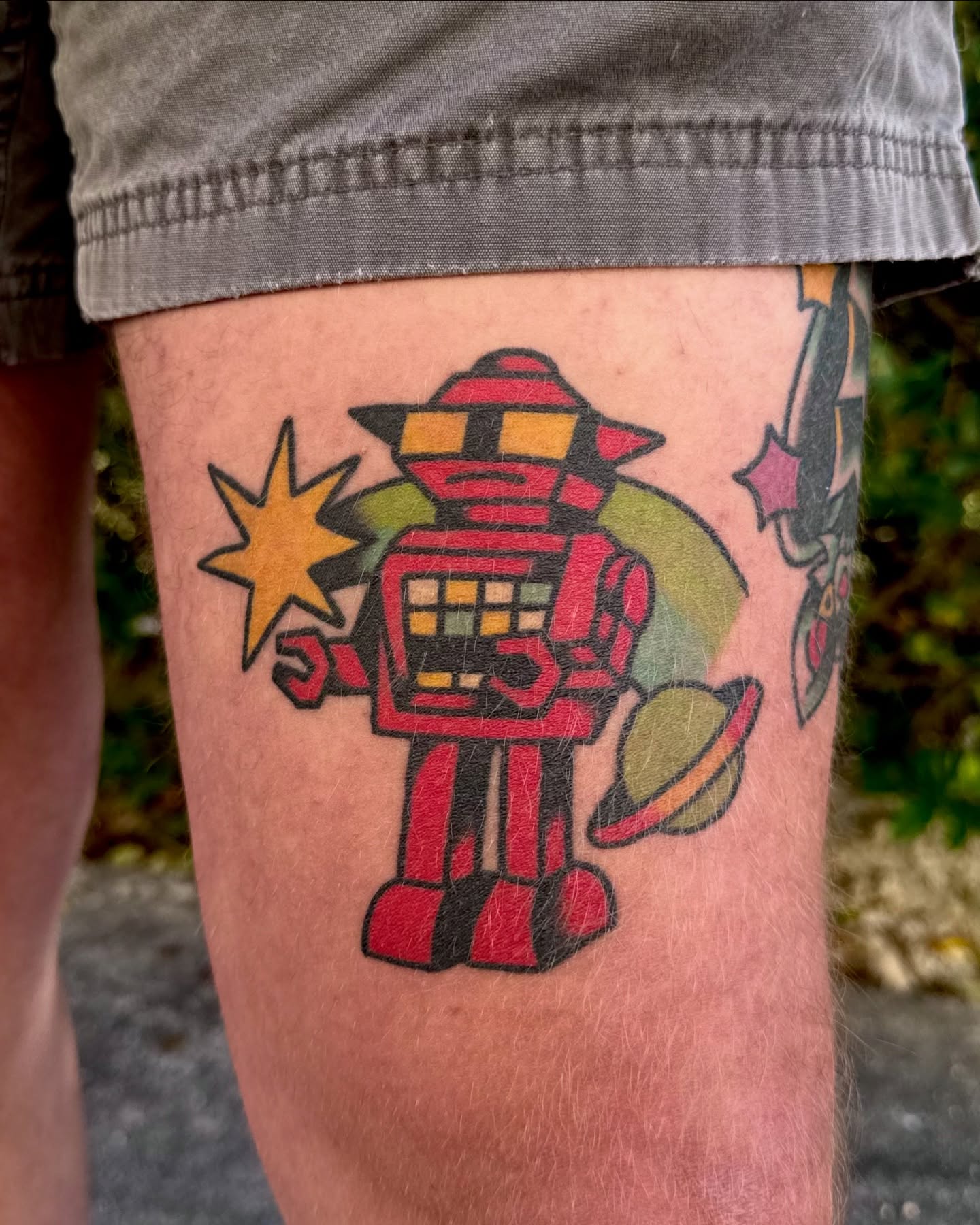 Robot American traditional tattoo on the thigh by Peach