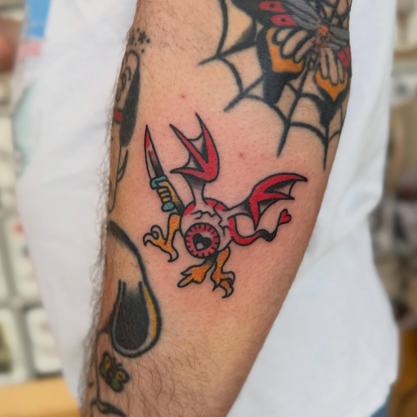 Demon with knife American traditional tattoo on the forearm by Elle Yax