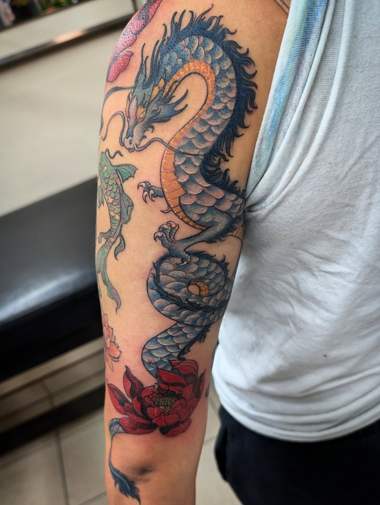 Dragon and lotus japanese irezumi tattoo on the forearm by Katherine