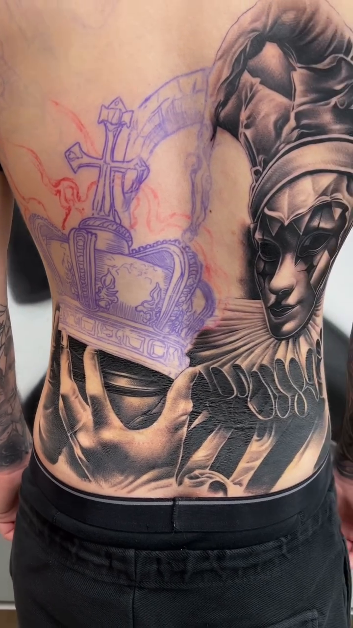 Jester mask and crown realism tattoo by Antonio Pavić, Los Angeles, California