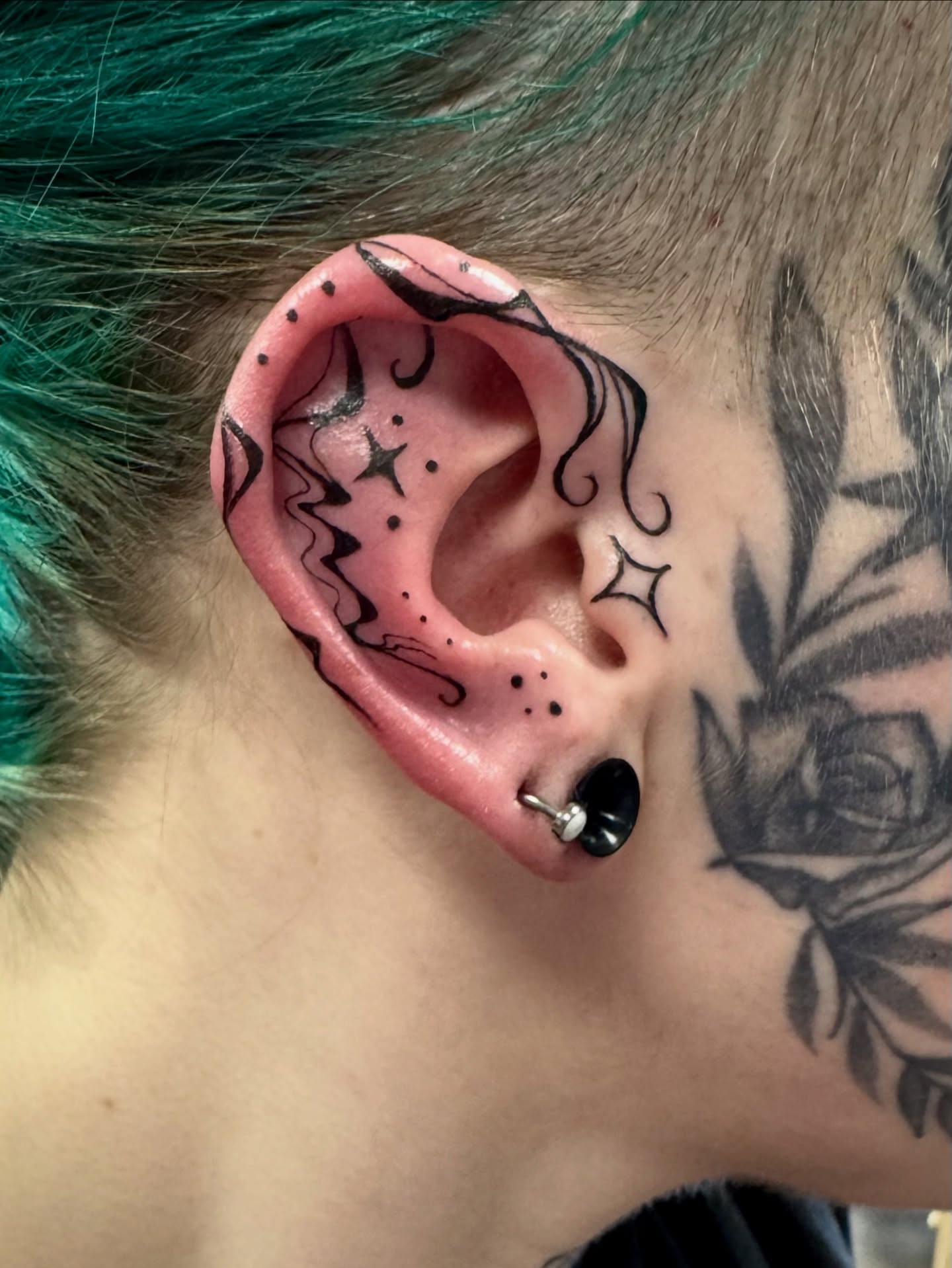 Space-themed ear dotwork tattoo by Samantha Jane
