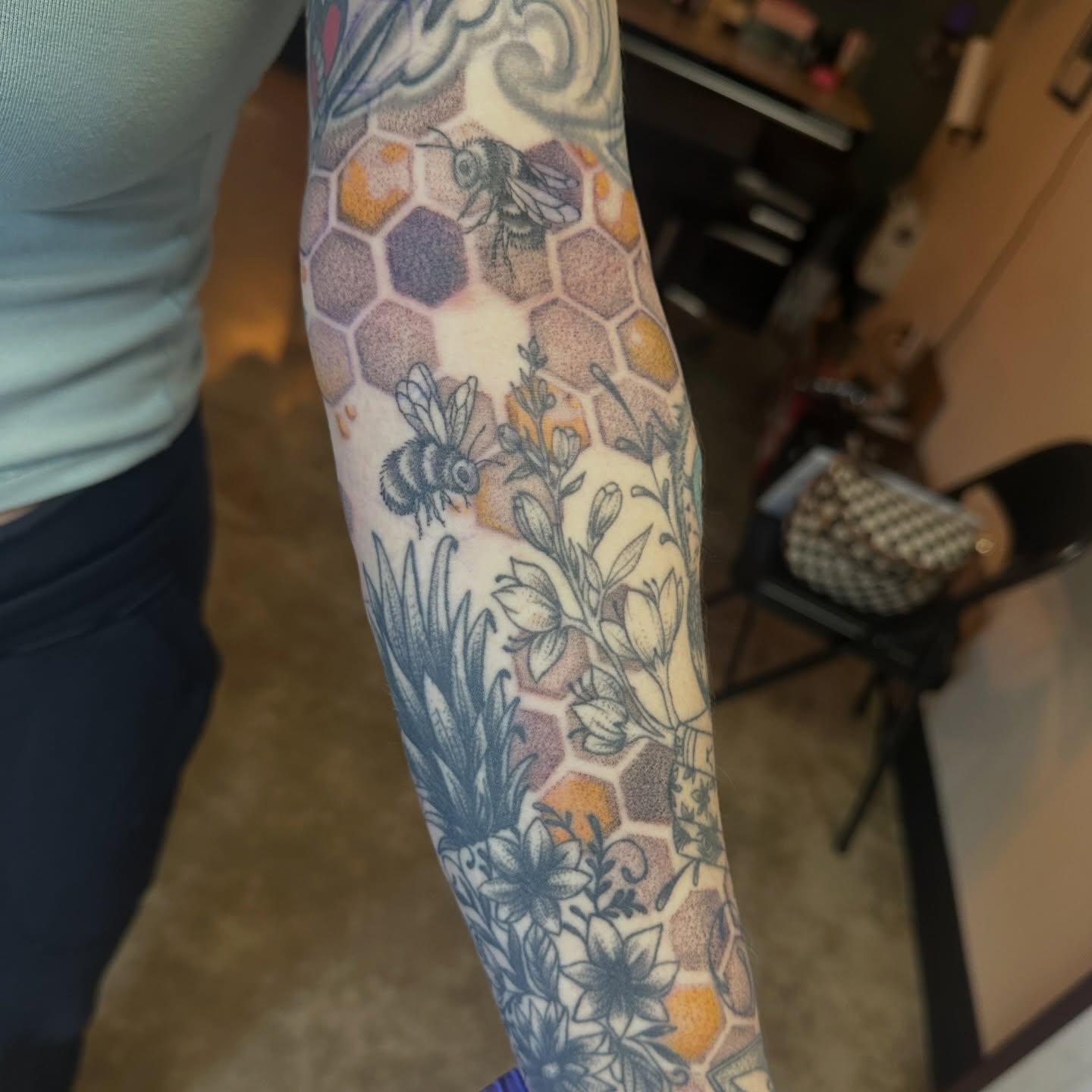 Honeycomb and bees dotwork tattoo on the forearm by Luisa Gonzalez, Austin, Texas