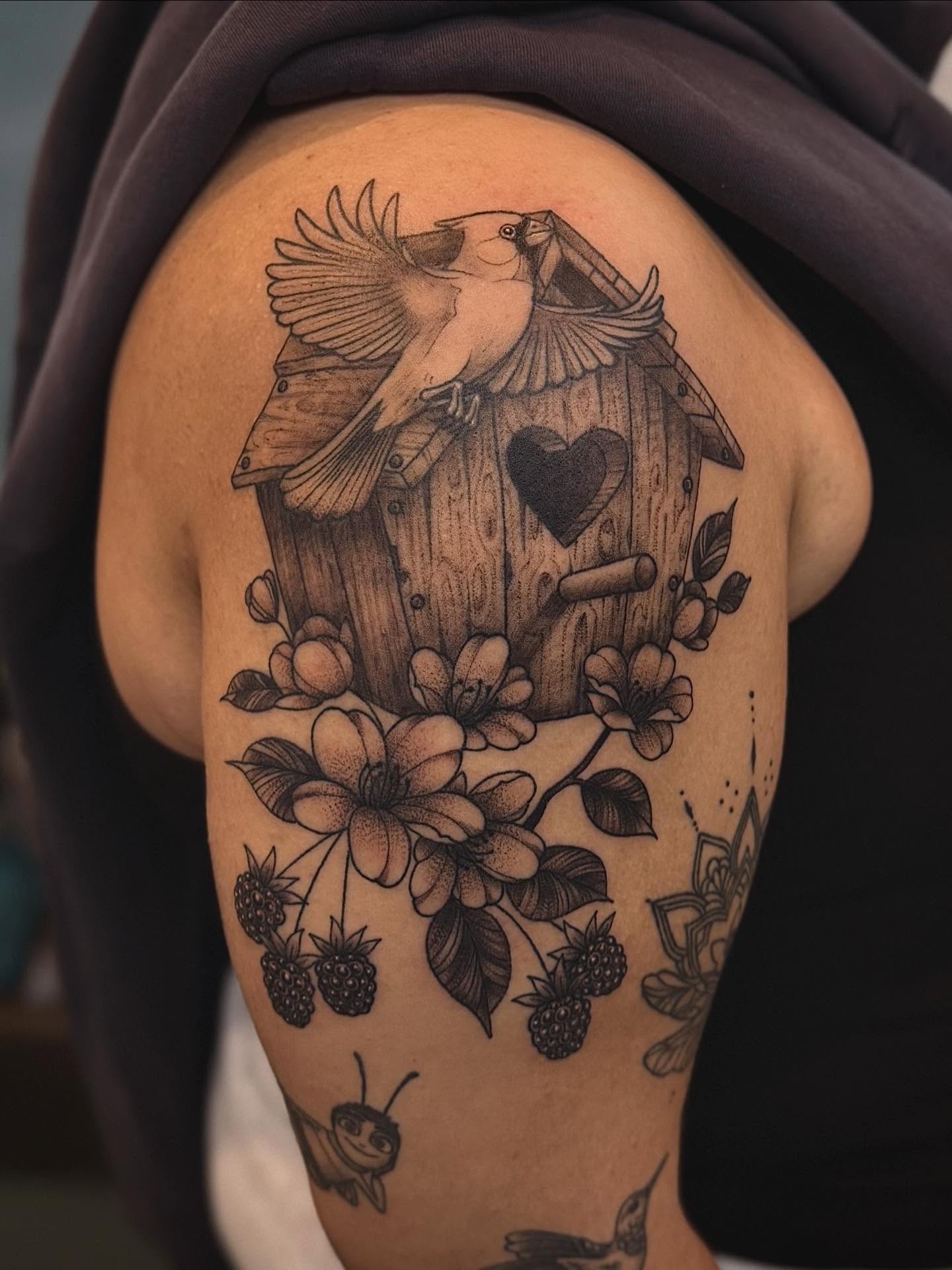 Birdhouse and cardinal realism tattoo on the shoulder by Ashley Kayser