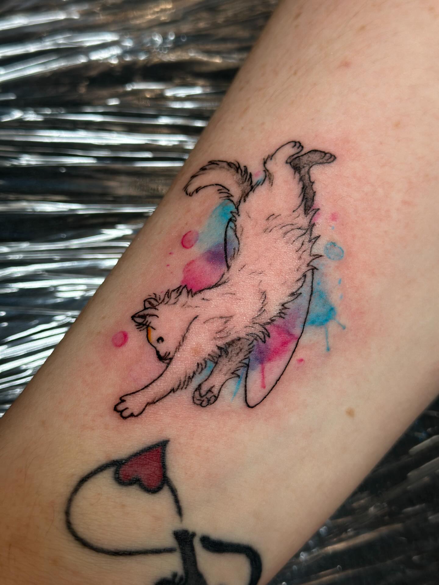 Cat watercolor tattoo on the forearm by Tiago Britto
