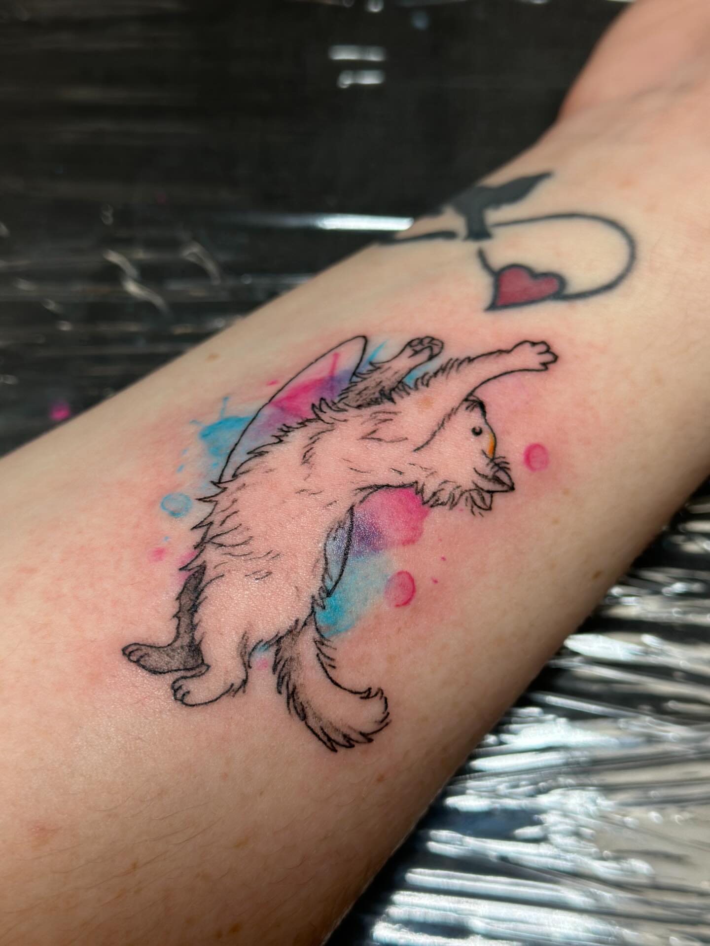 Cat watercolor tattoo on the forearm by Tiago Britto
