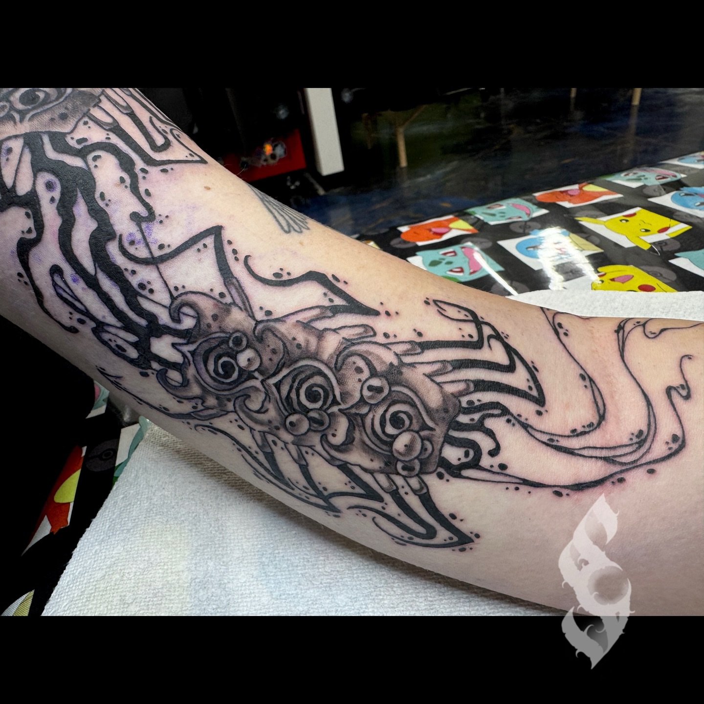 Octopus geometric tattoo on the forearm by Amanda Stampfly
