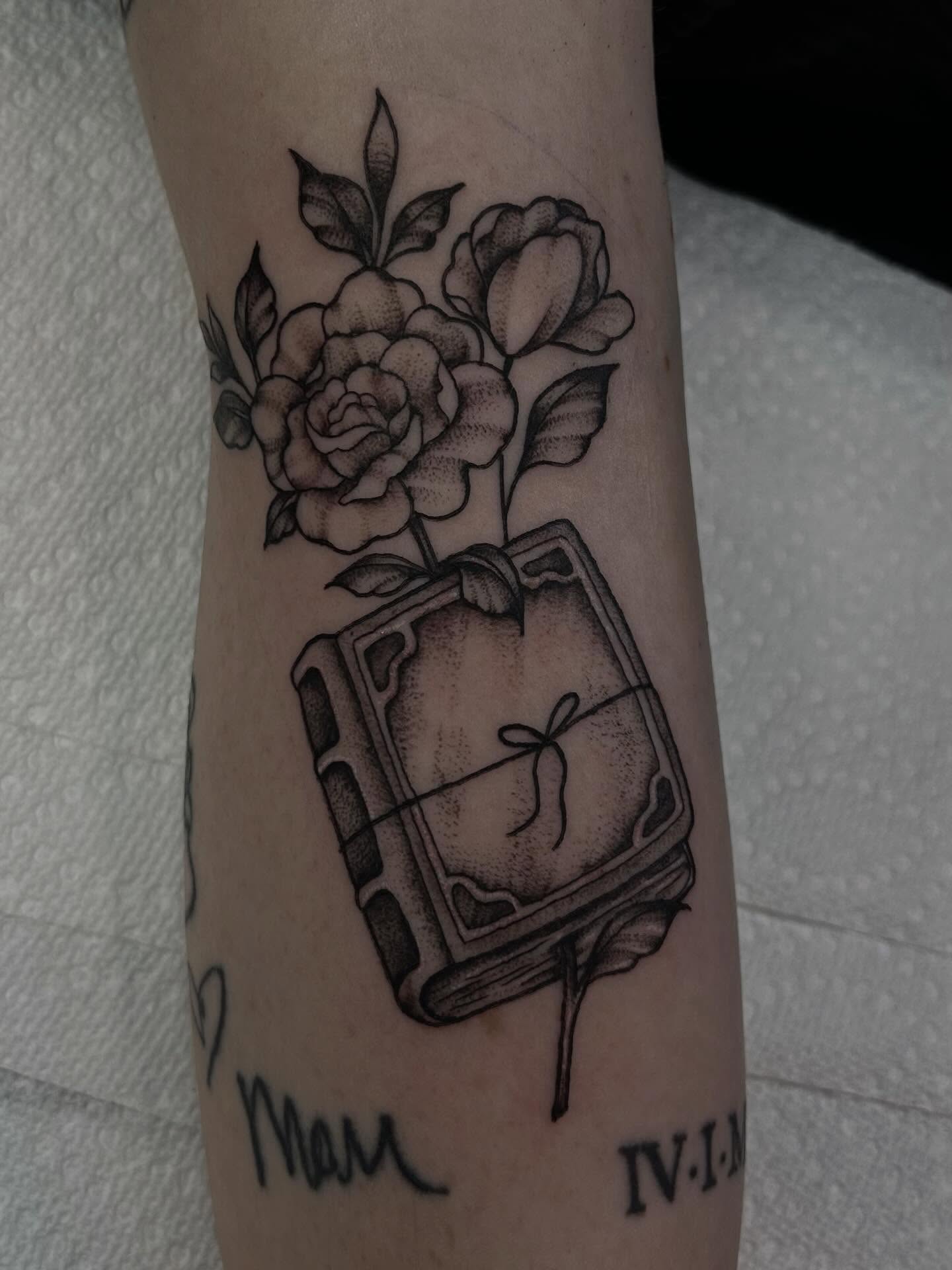 Book with roses black and grey tattoo on the forearm by abby ☽ marie