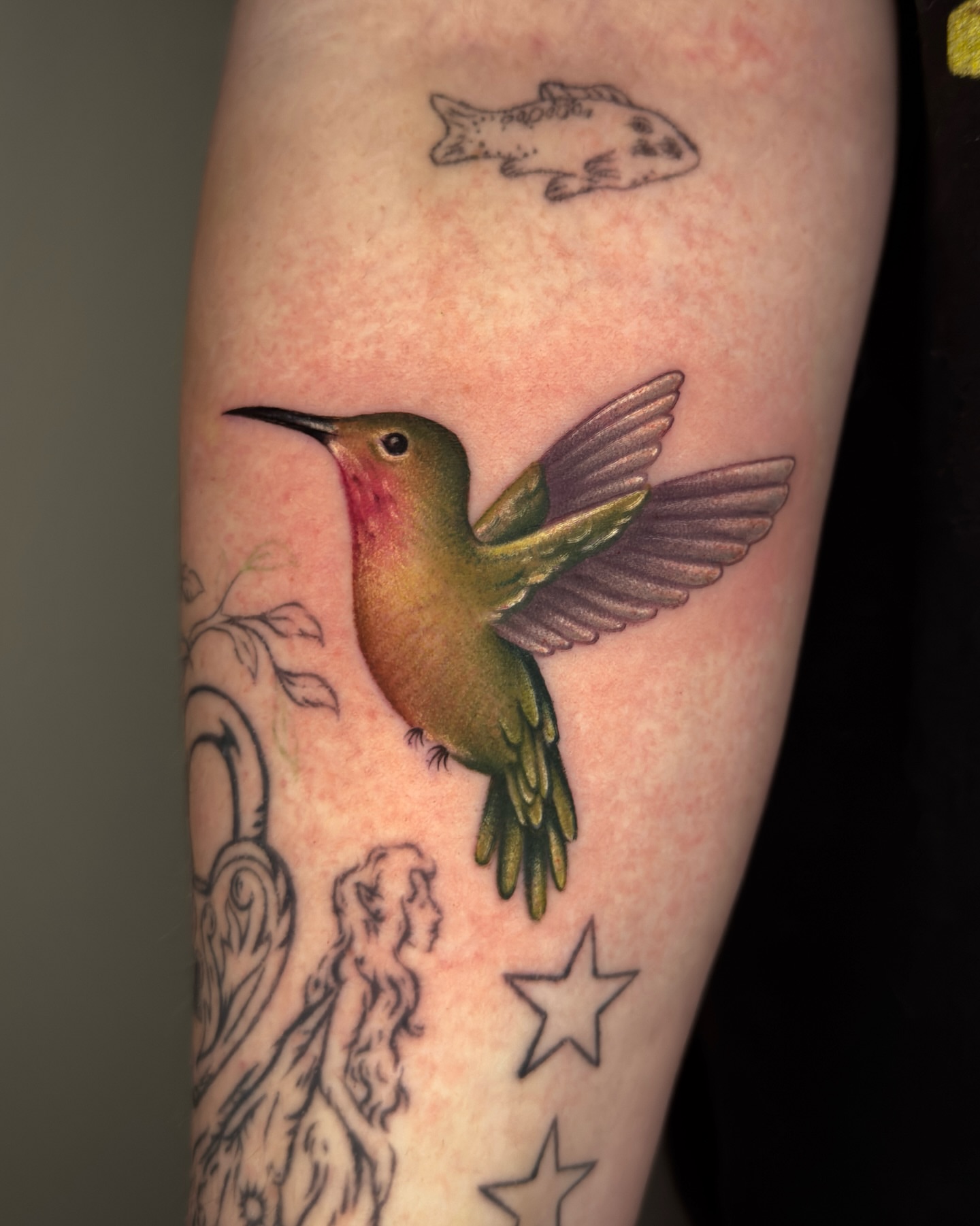 Hummingbird realism tattoo on the forearm by Nichole Lorence