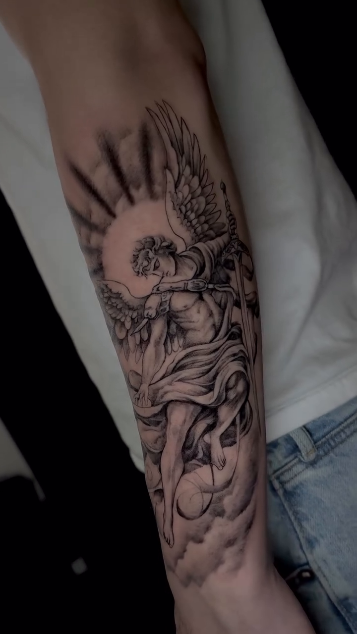 Angel with sun and clouds realism tattoo by Kris Tattoo Chicago