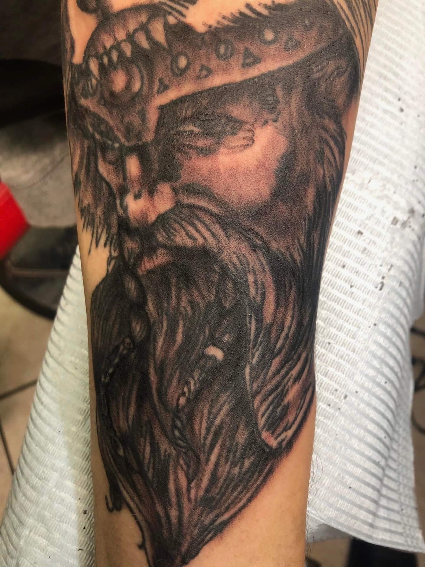 Viking warrior realism tattoo on the forearm by @juiceinkythings