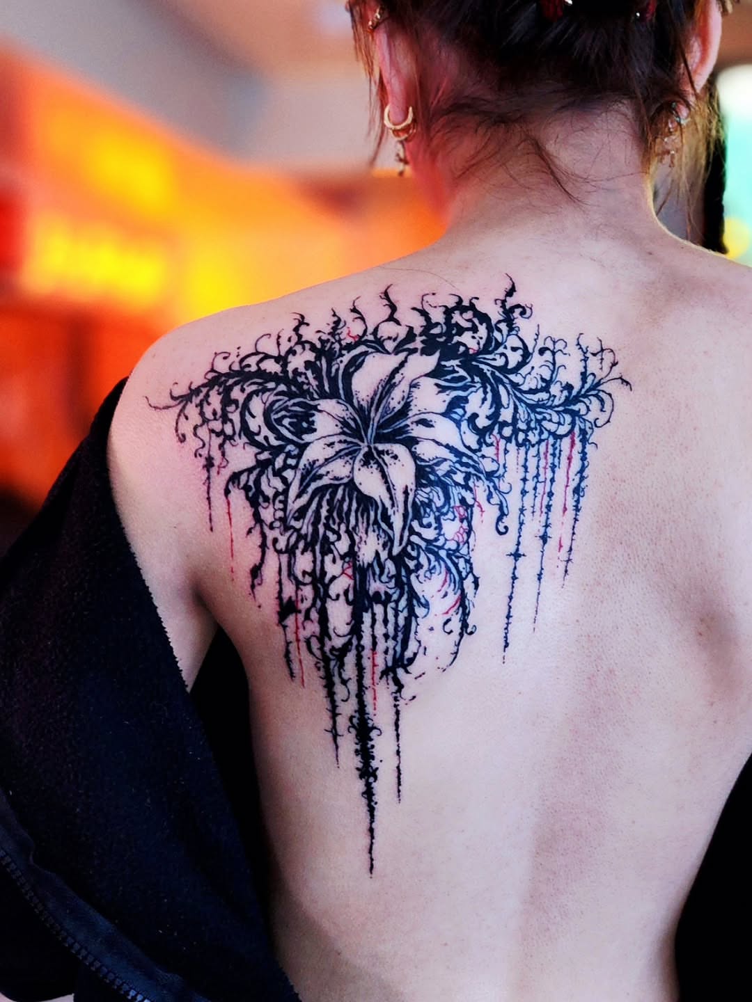 Lily black and grey tattoo on the back by Luke Jordan Ink, Louisville, Colorado