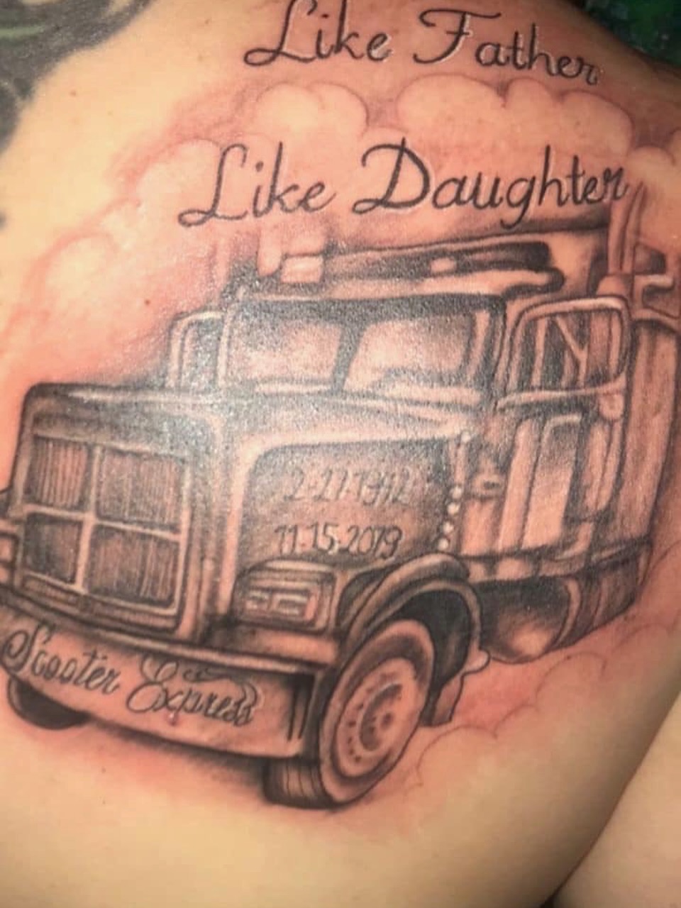 Fire truck black and grey tattoo on the back by @juiceinkythings